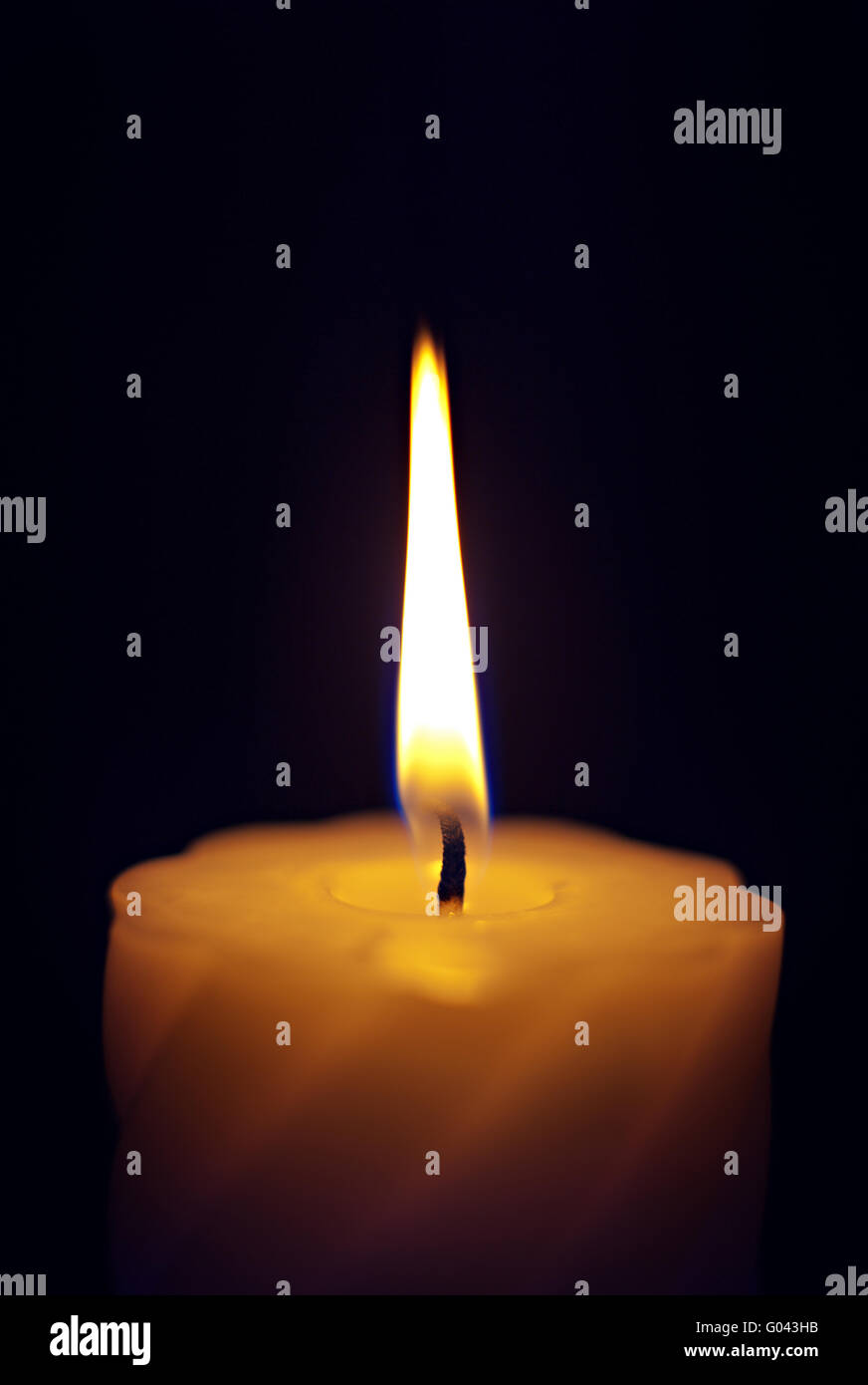 Close-up of a candle flame against a black background Stock Photo - Alamy