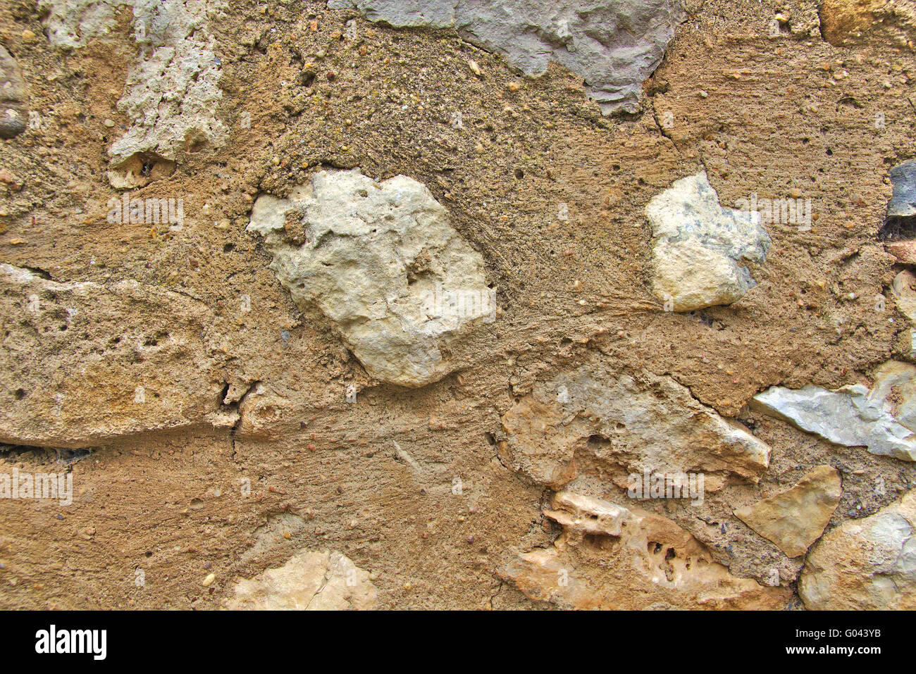Old grey and brown stone wall in town Stock Photo - Alamy
