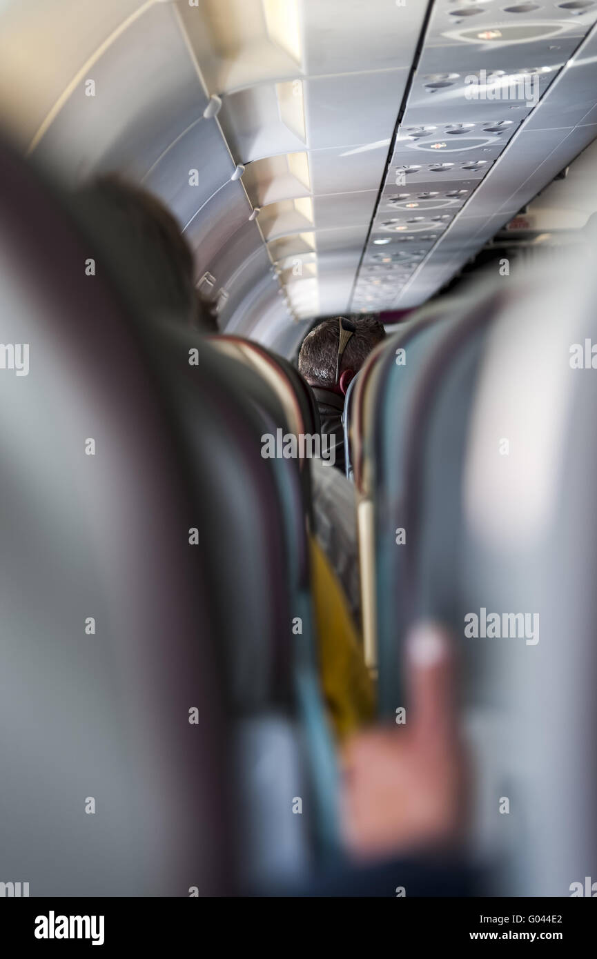 Rear view of a man's head in the seats of a passen Stock Photo