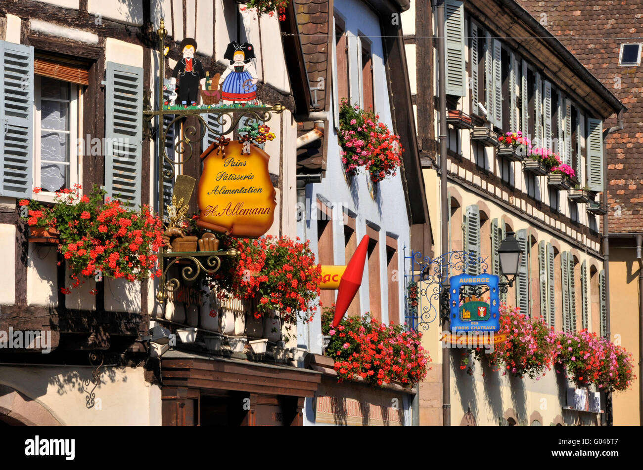 Signs, figurehead, half-timbered houses, old town, Rue du Rempart, Eguisheim, Alsace, France / half-timber house Stock Photo