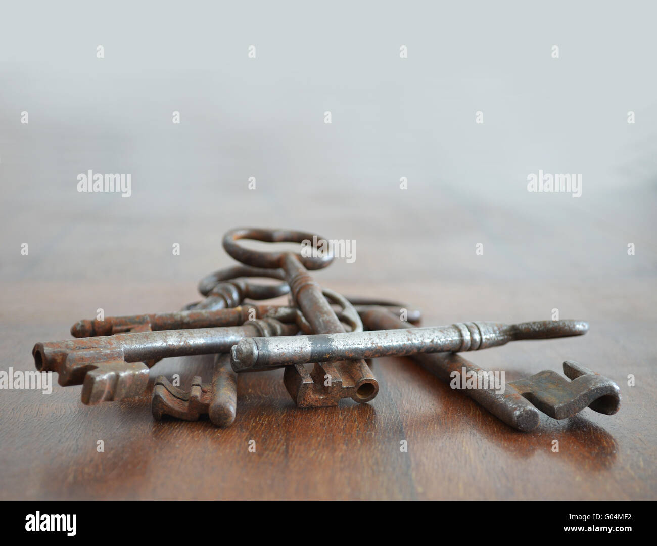 Bunch of old rusted keys on wood surface Stock Photo - Alamy