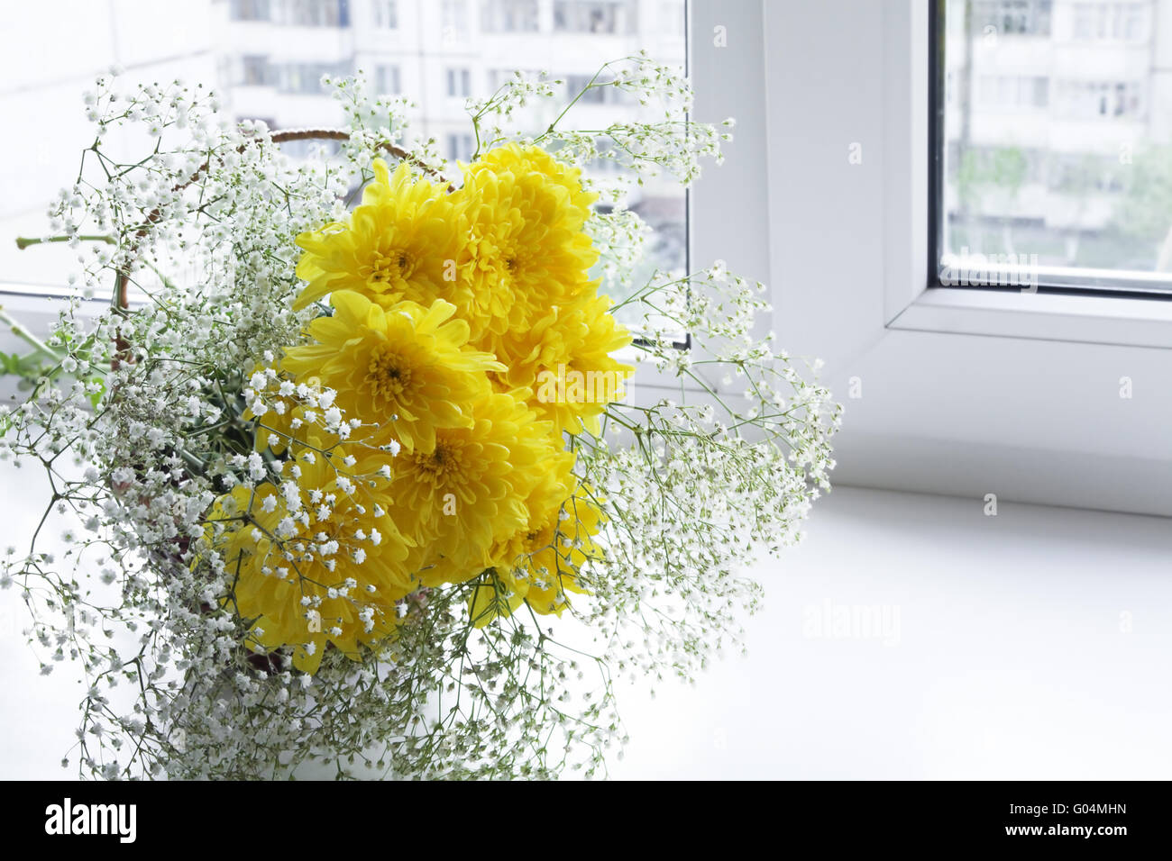 Fresh spring flowers in a vase on a window sill Stock Photo - Alamy