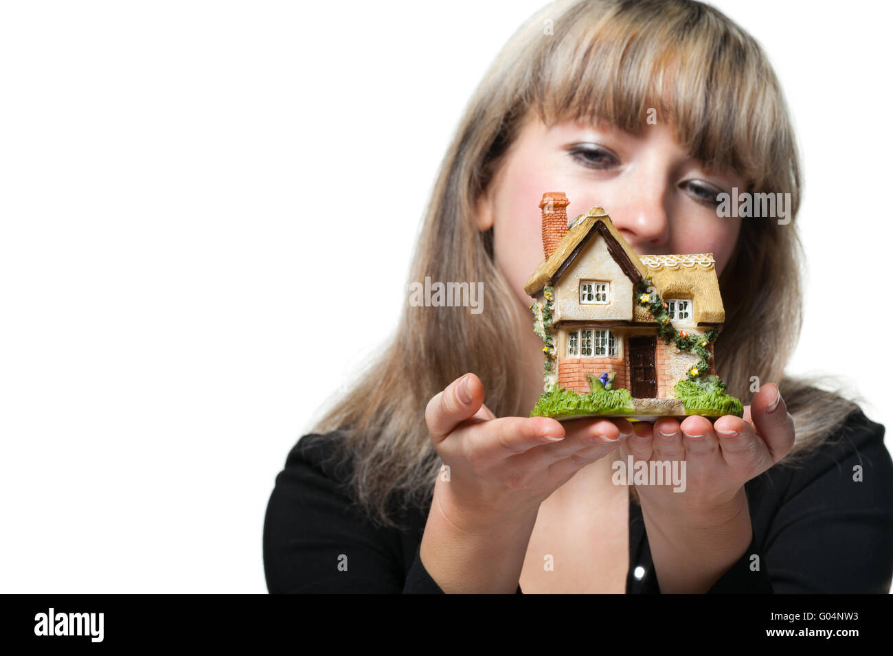 The business woman holds the small house in the hands Stock Photo - Alamy