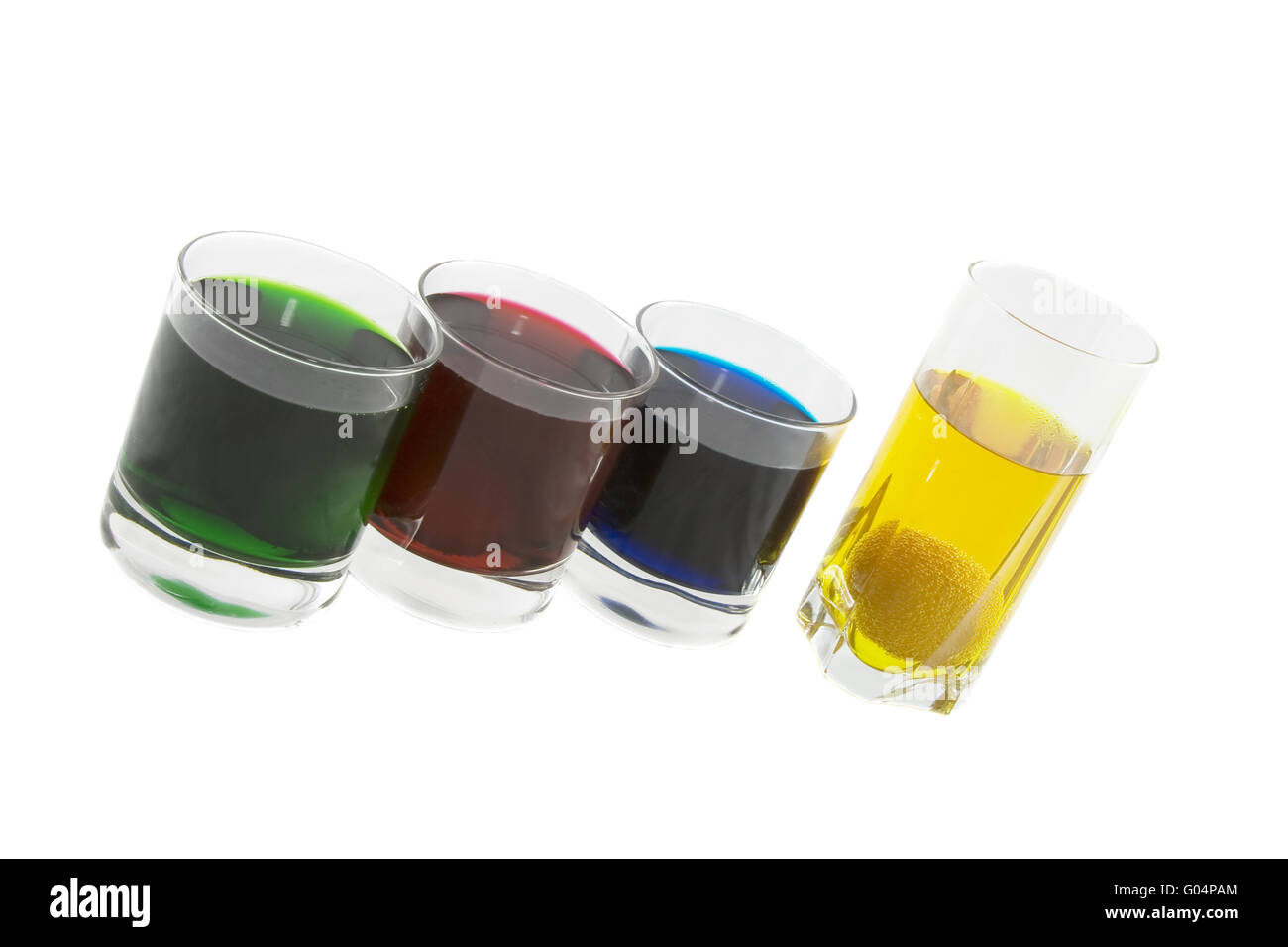 Four glasses with multicoloured cocktails isolated over white