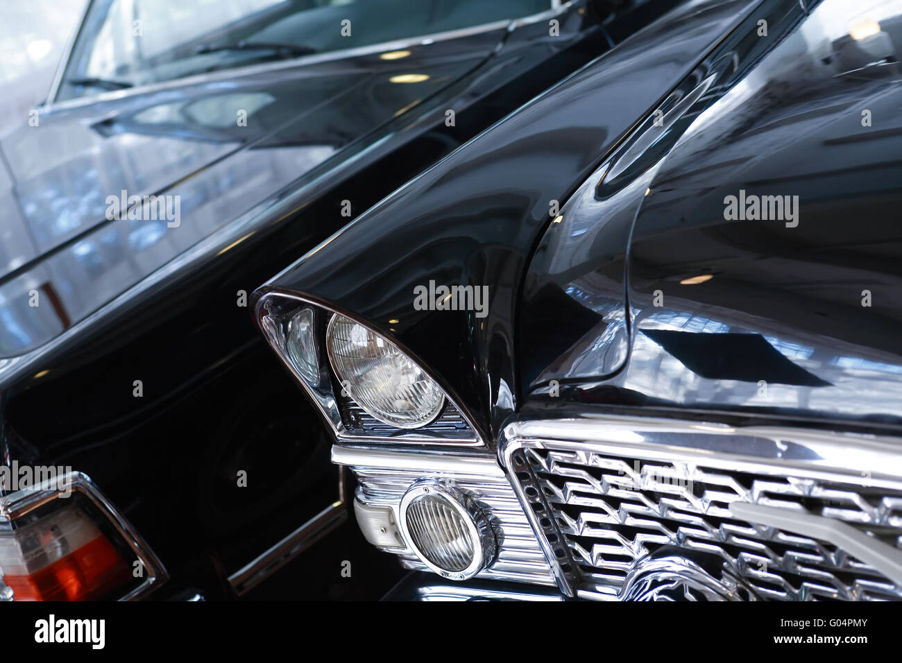 Retro cars. Closeup of elegant vintage black limousines Stock Photo