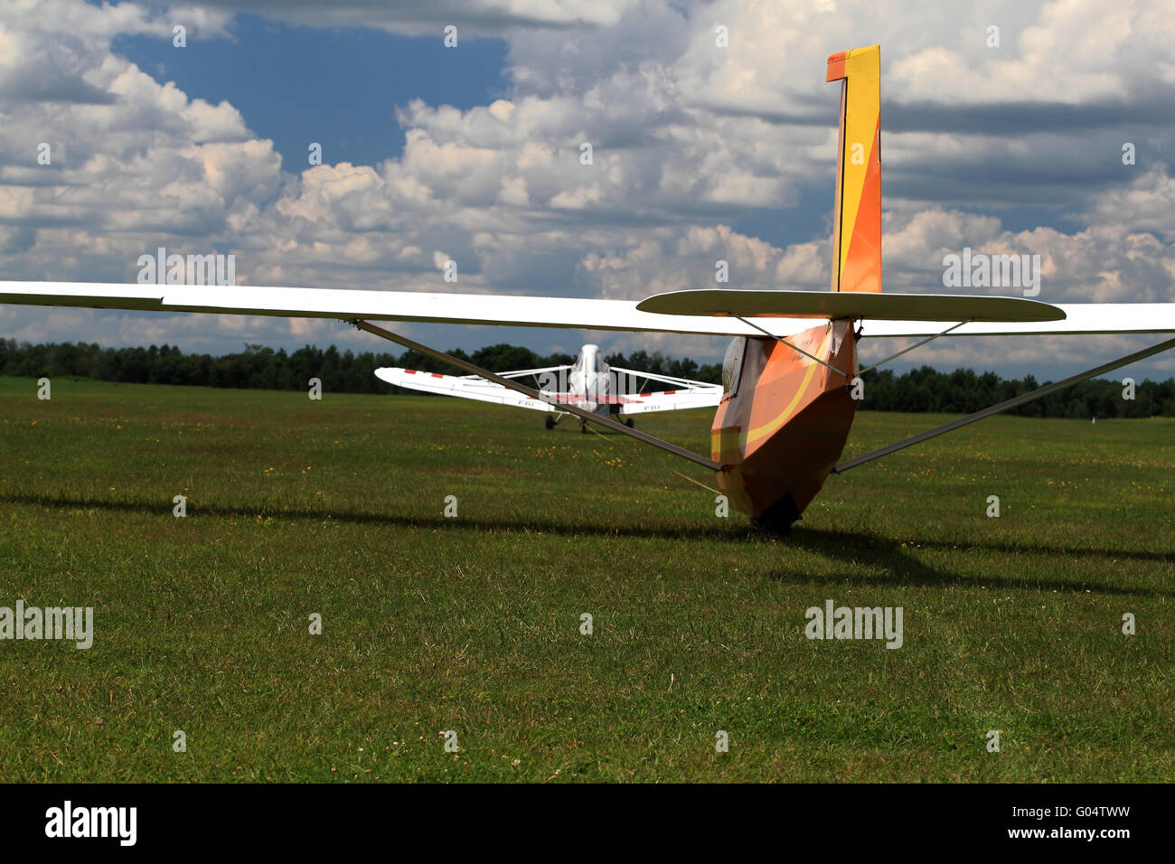 Tandem towplane, glider on start line ready to run Stock Photo Alamy