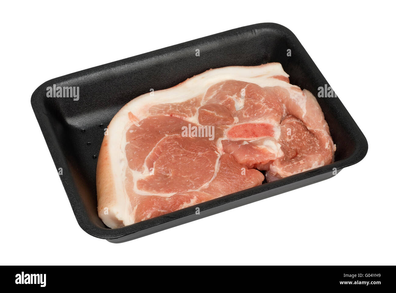 Piece of fresh fat pork with a bone and skin in the standard plastic container. Cheap ingredient for tasty soup. Isolated with p Stock Photo