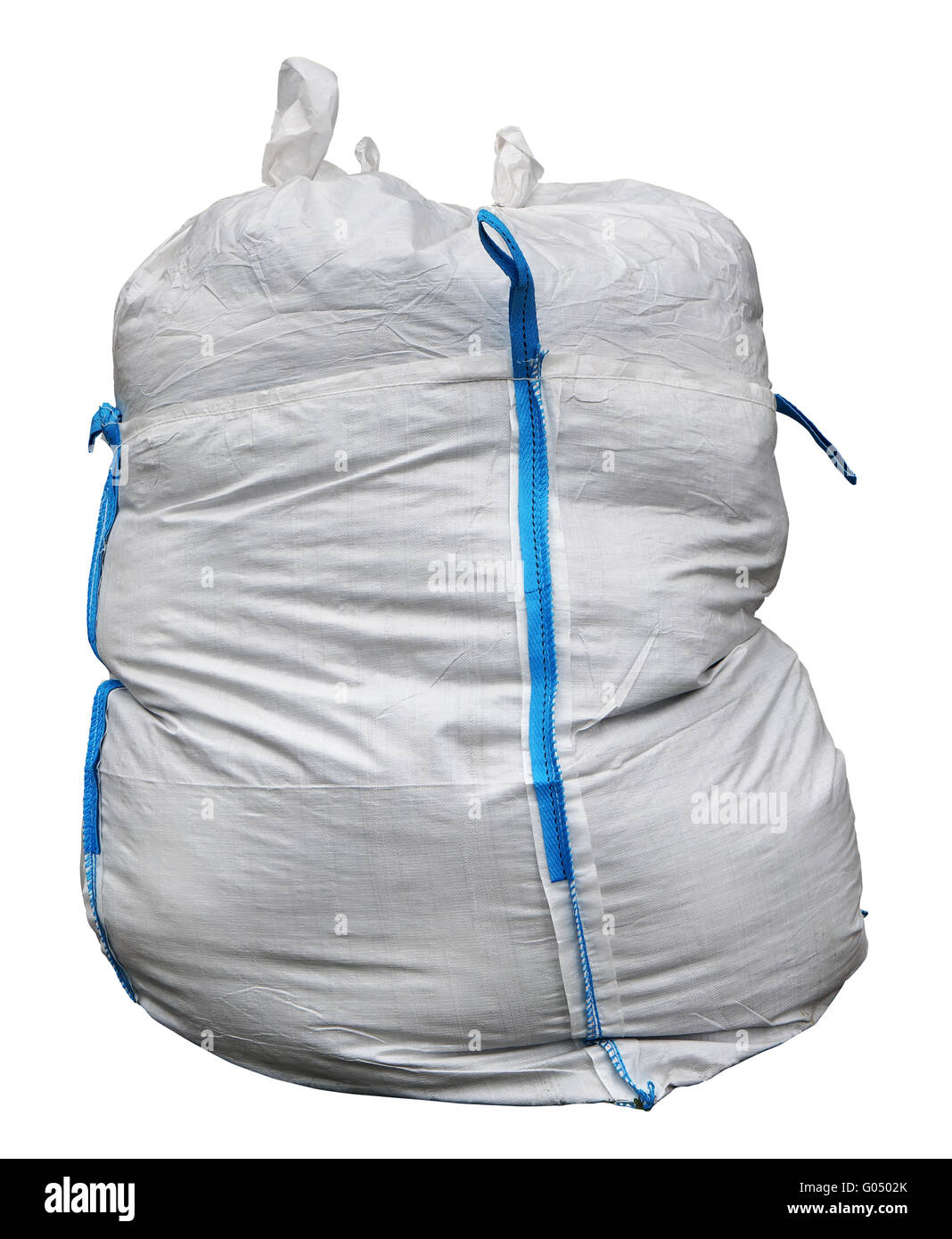 The big bag for construction debris is made of a white synthetic sacking and has blue loops for transportation. Isolated with pa Stock Photo