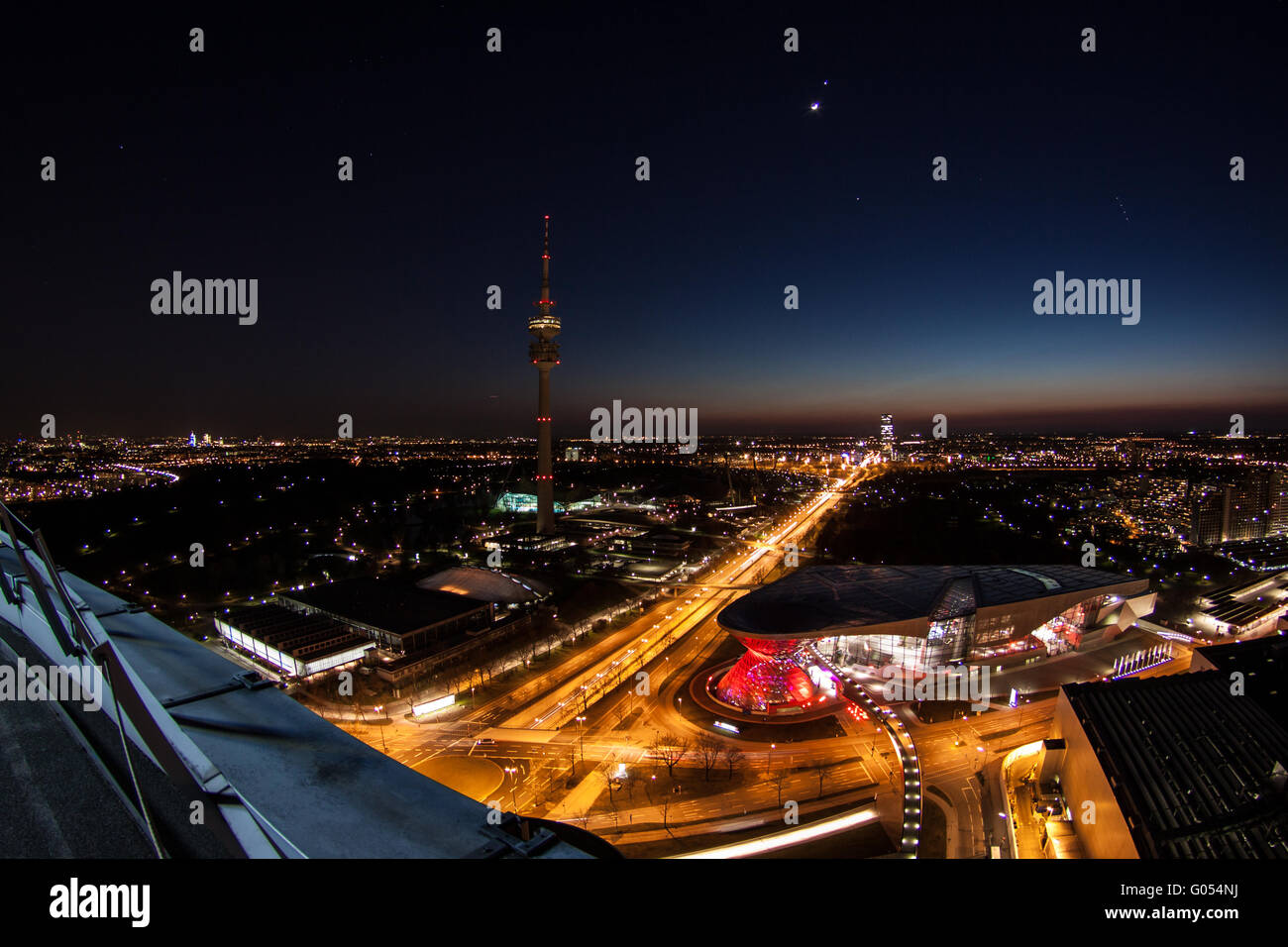 Munich at night with olympic tower and BMW World Stock Photo