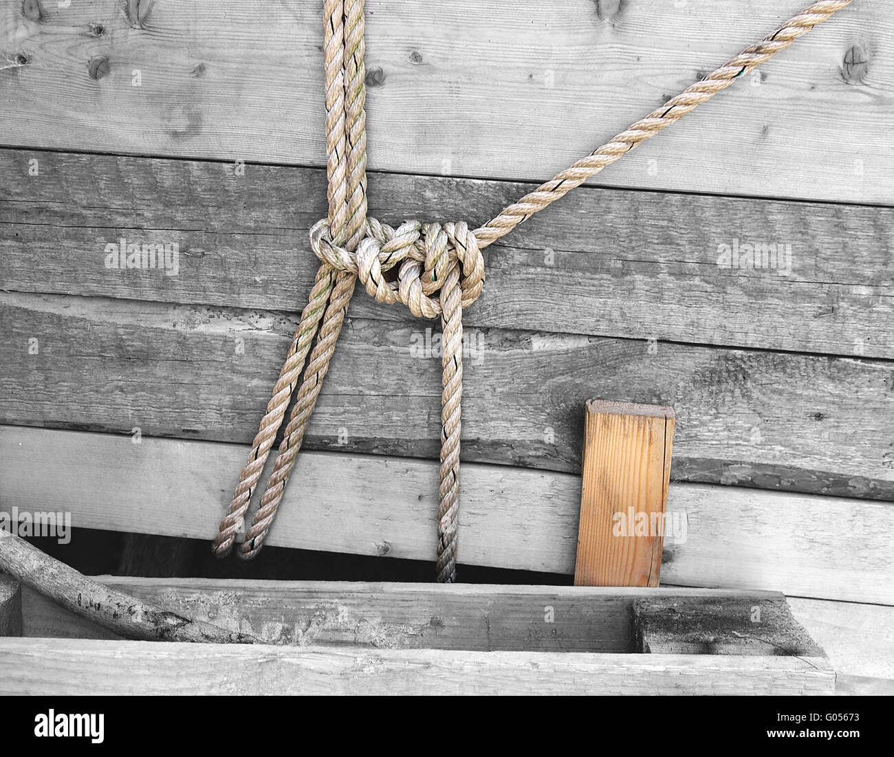 ropes knoted on wood Stock Photo