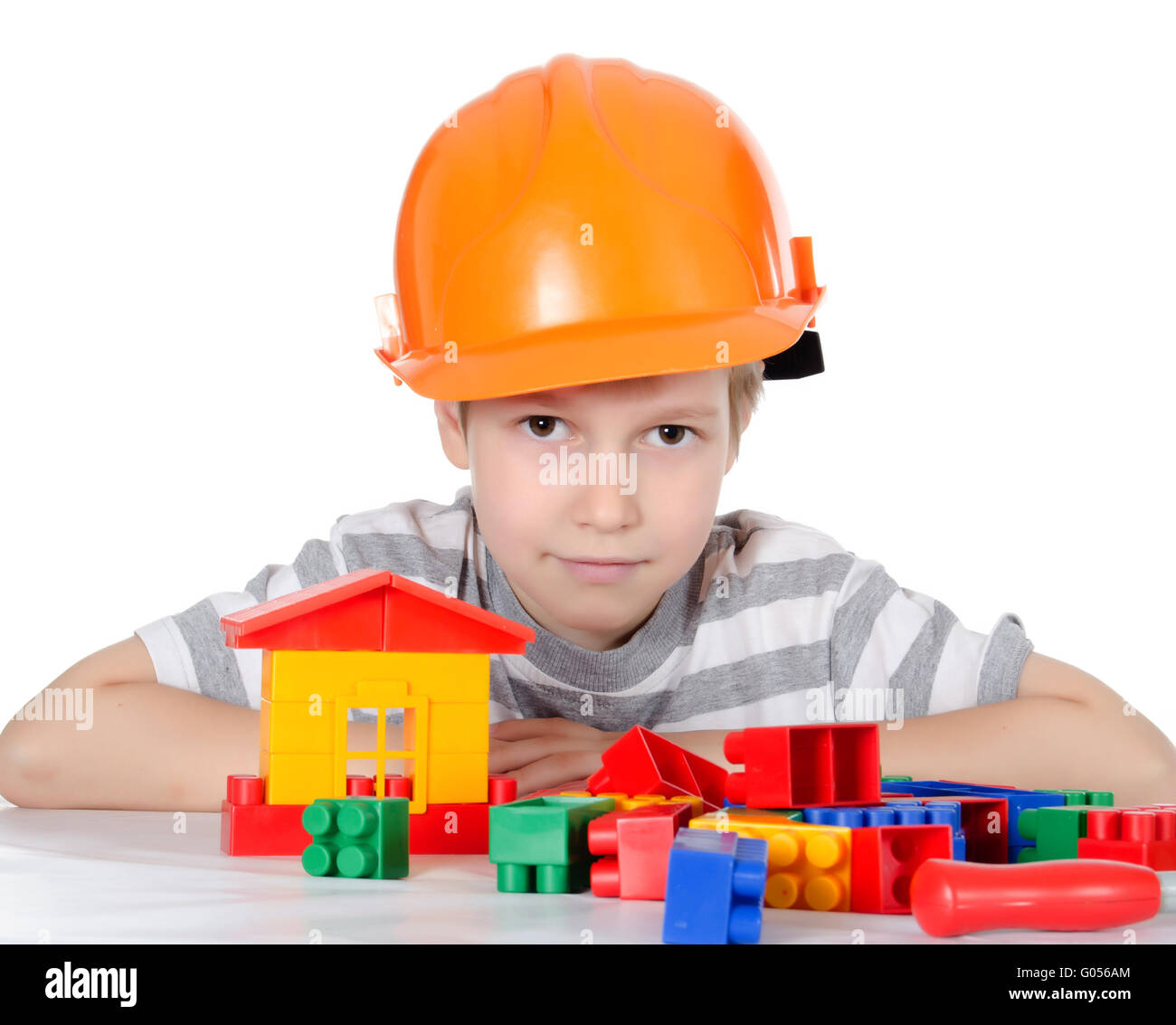 The boy collects the designer isolated on white Stock Photo - Alamy