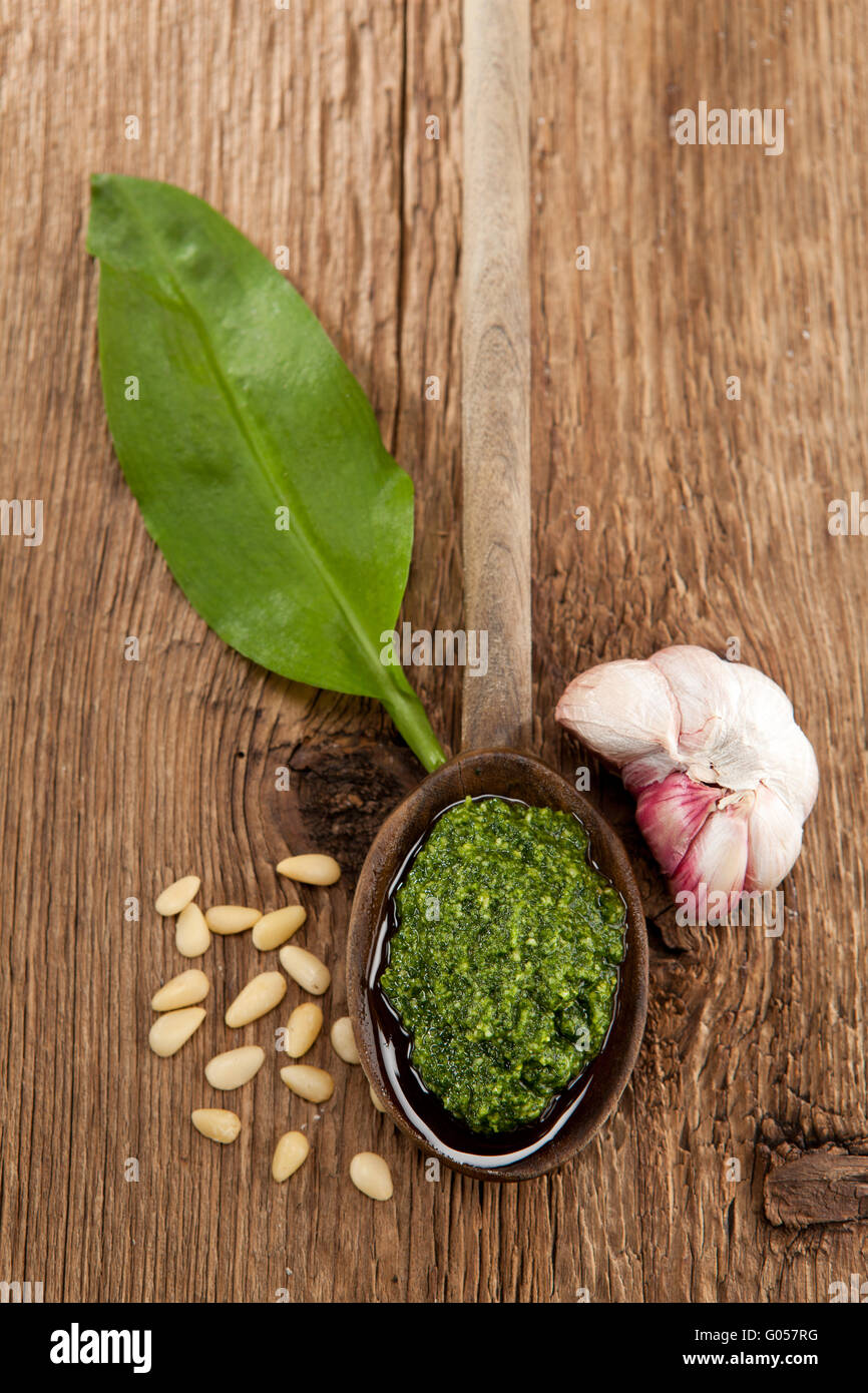 Homemade Wild garlic pesto on a wooden spoon Stock Photo