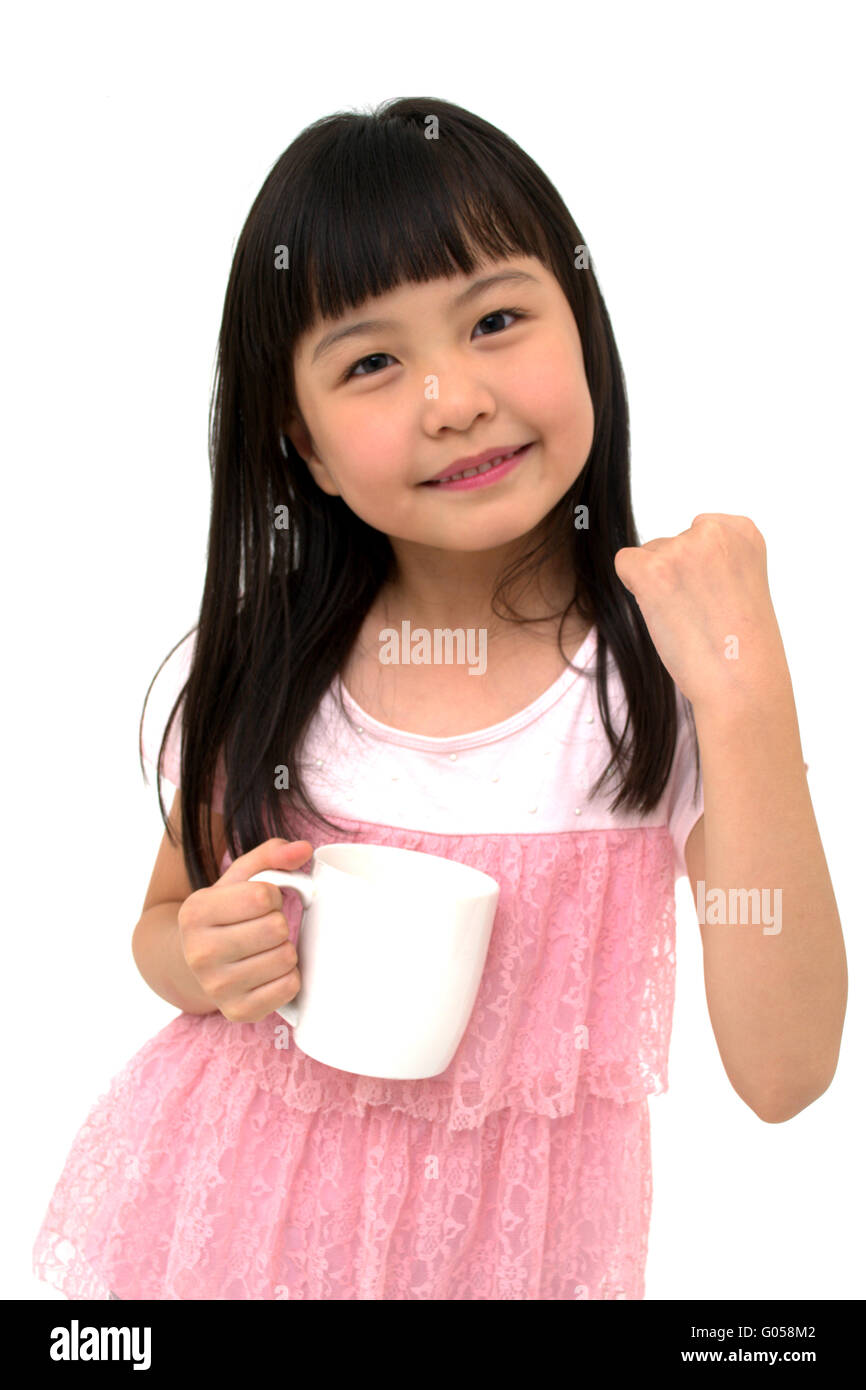 Poweful Little Asian Girl with Cup, isolated on wh Stock Photo