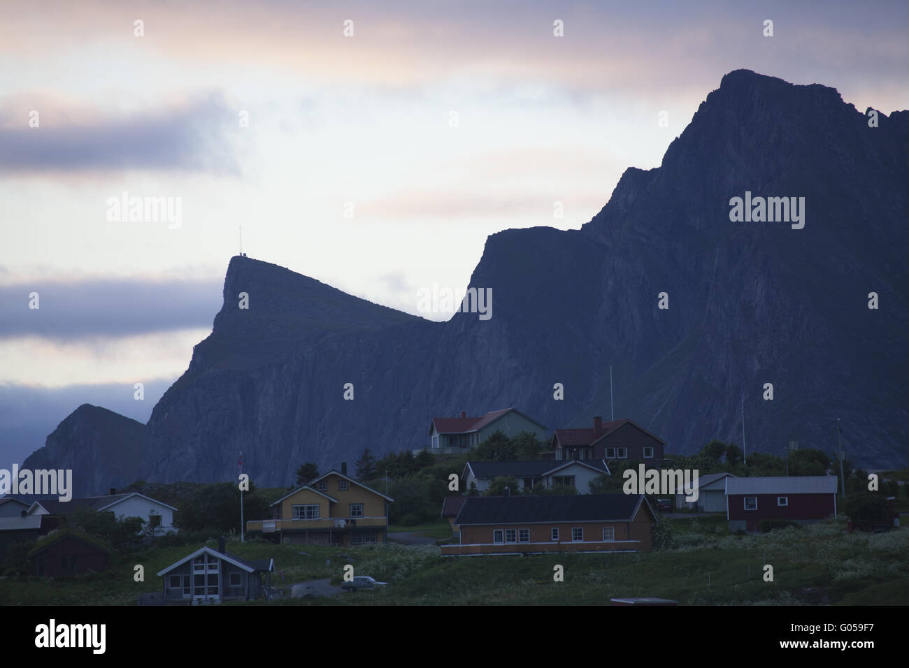 Buildings next to a mountain, Ramberg, Norway Stock Photo