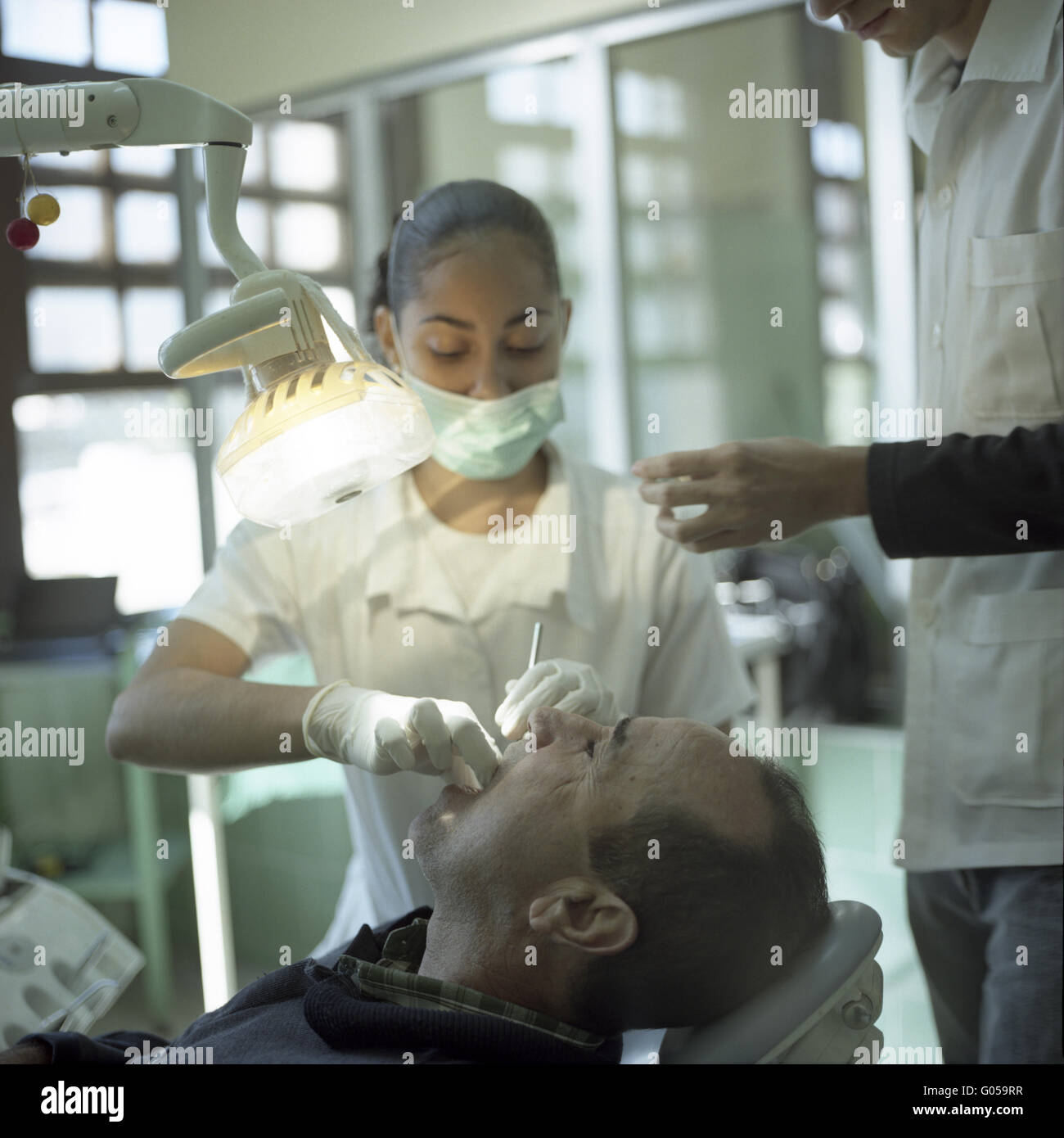 Latina dental nurse and patient Stock Photo