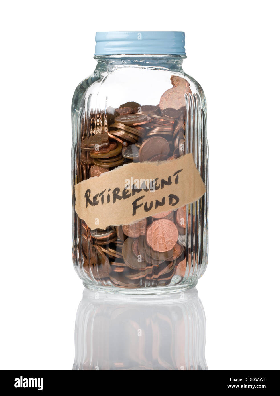 Retirement Fund written on a glass jar that is used for saving money. Stock Photo