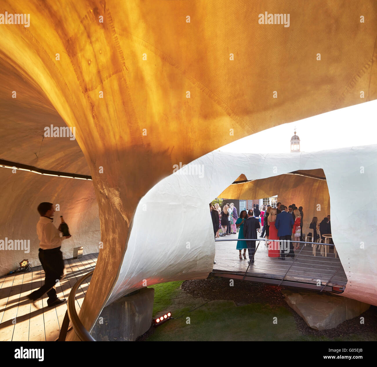 Opening at the Serpentine Summer Pavilion 2014. Serpentine Summer Pavilion 2014, London, United Kingdom. Architect: Smiljan Radic, 2014. Stock Photo