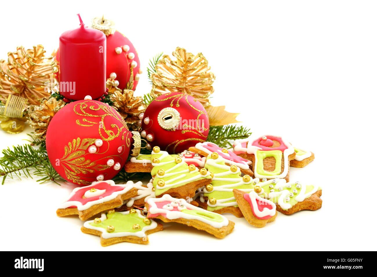 Christmas cookies, red balls and golden cones. Stock Photo