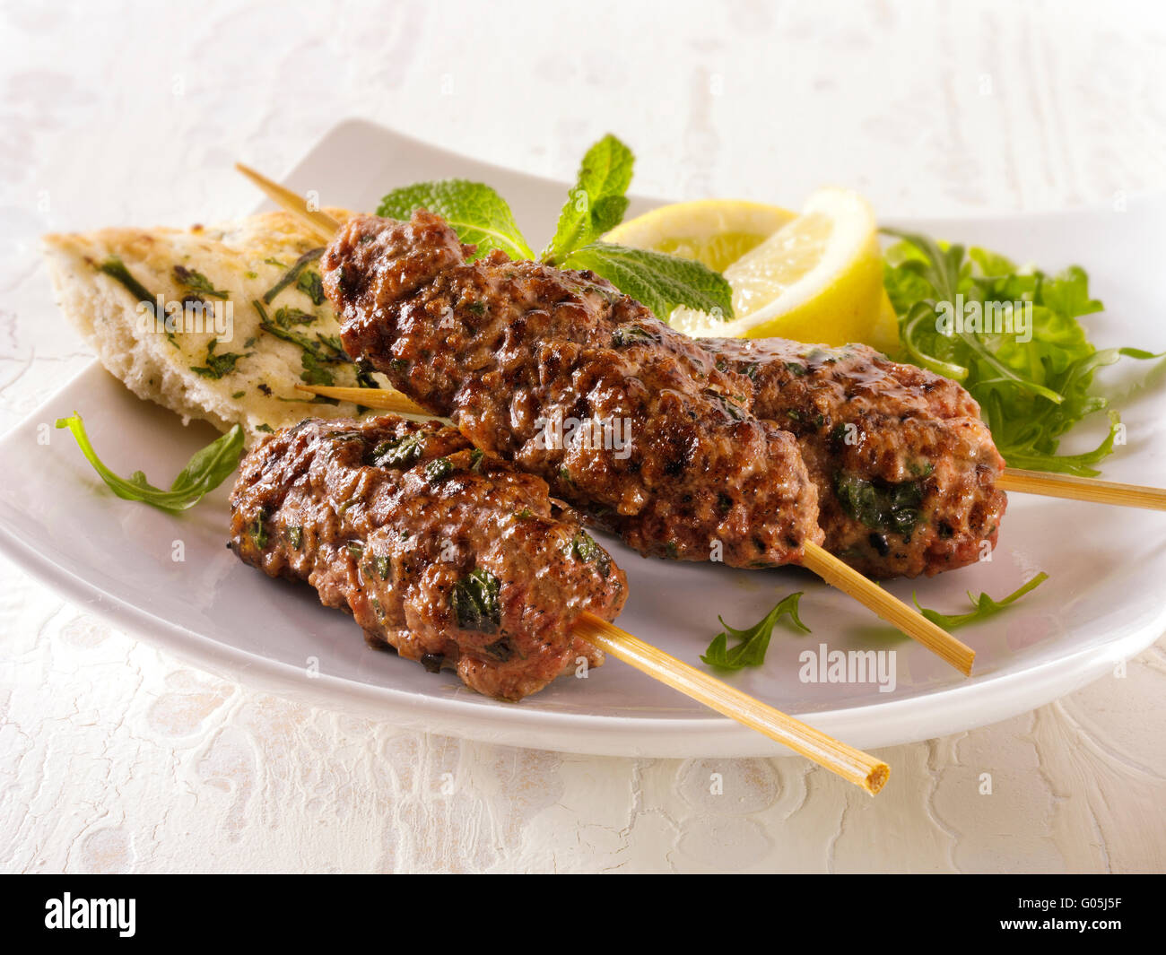 Kofte Kebab with salad & lemnon wedges Stock Photo