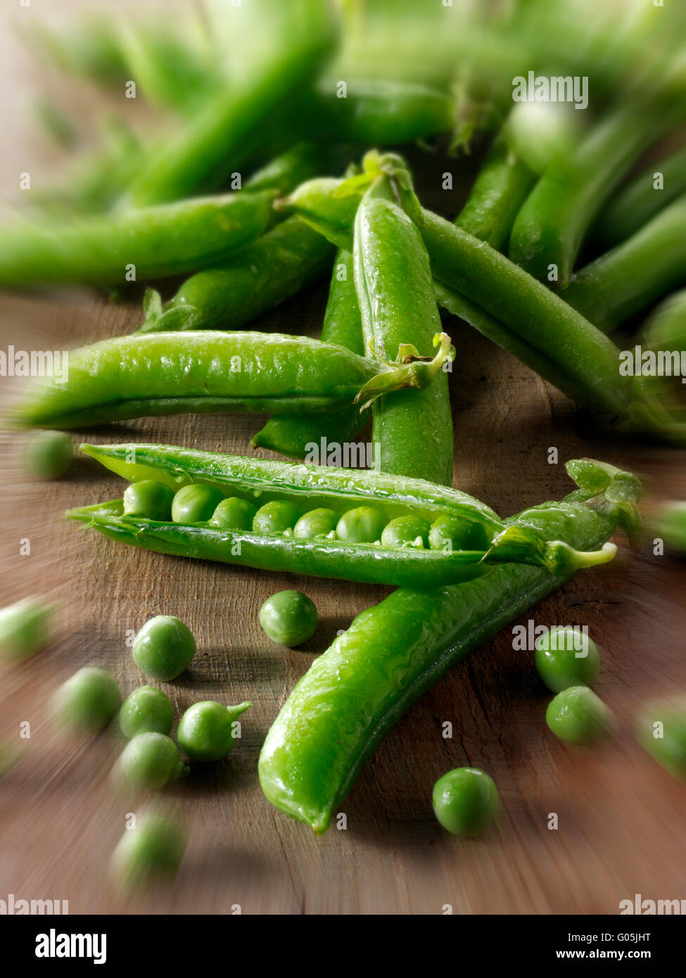 Fresh picked garden peas and pea pods Stock Photo