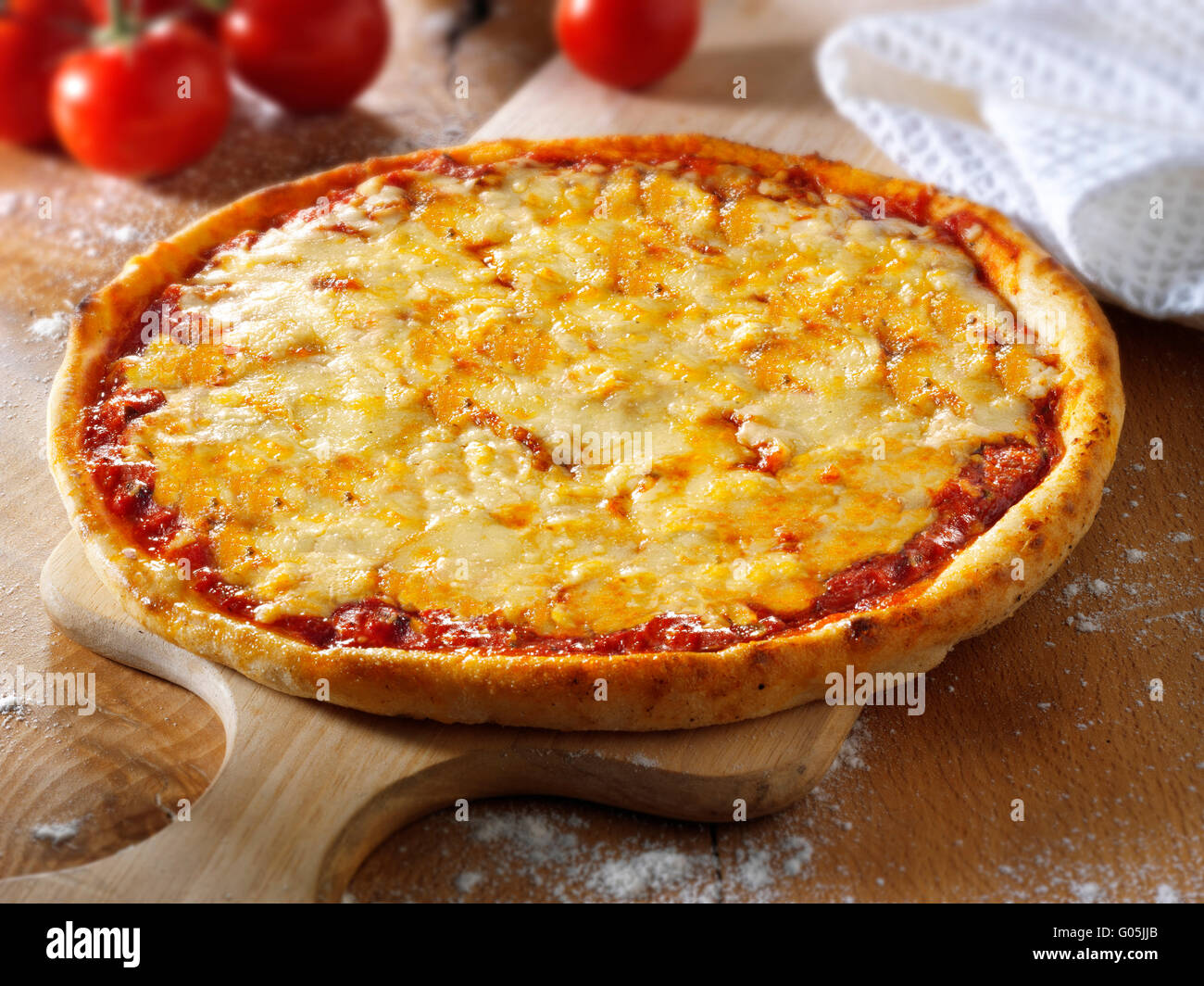 Cooked whole cheese and tomato Margherita pizza Stock Photo