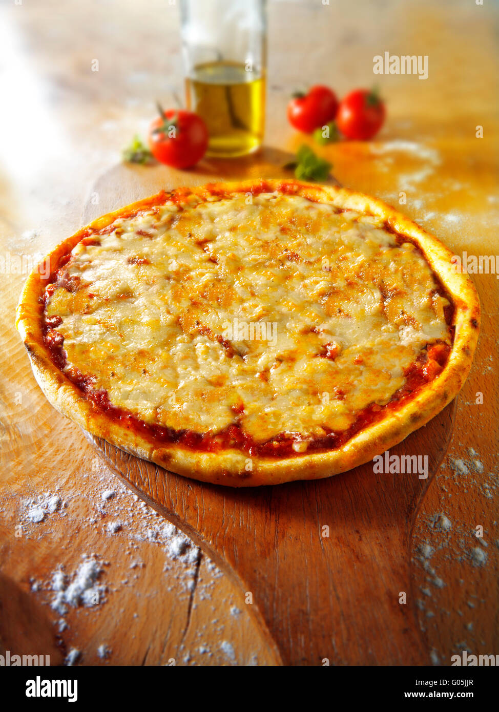 Cooked whole cheese and tomato Margherita pizza Stock Photo