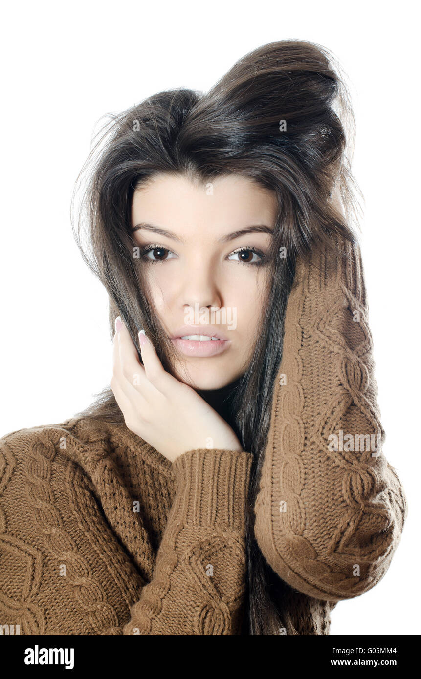 The beautiful girl in a brown sweater isolated Stock Photo Alamy