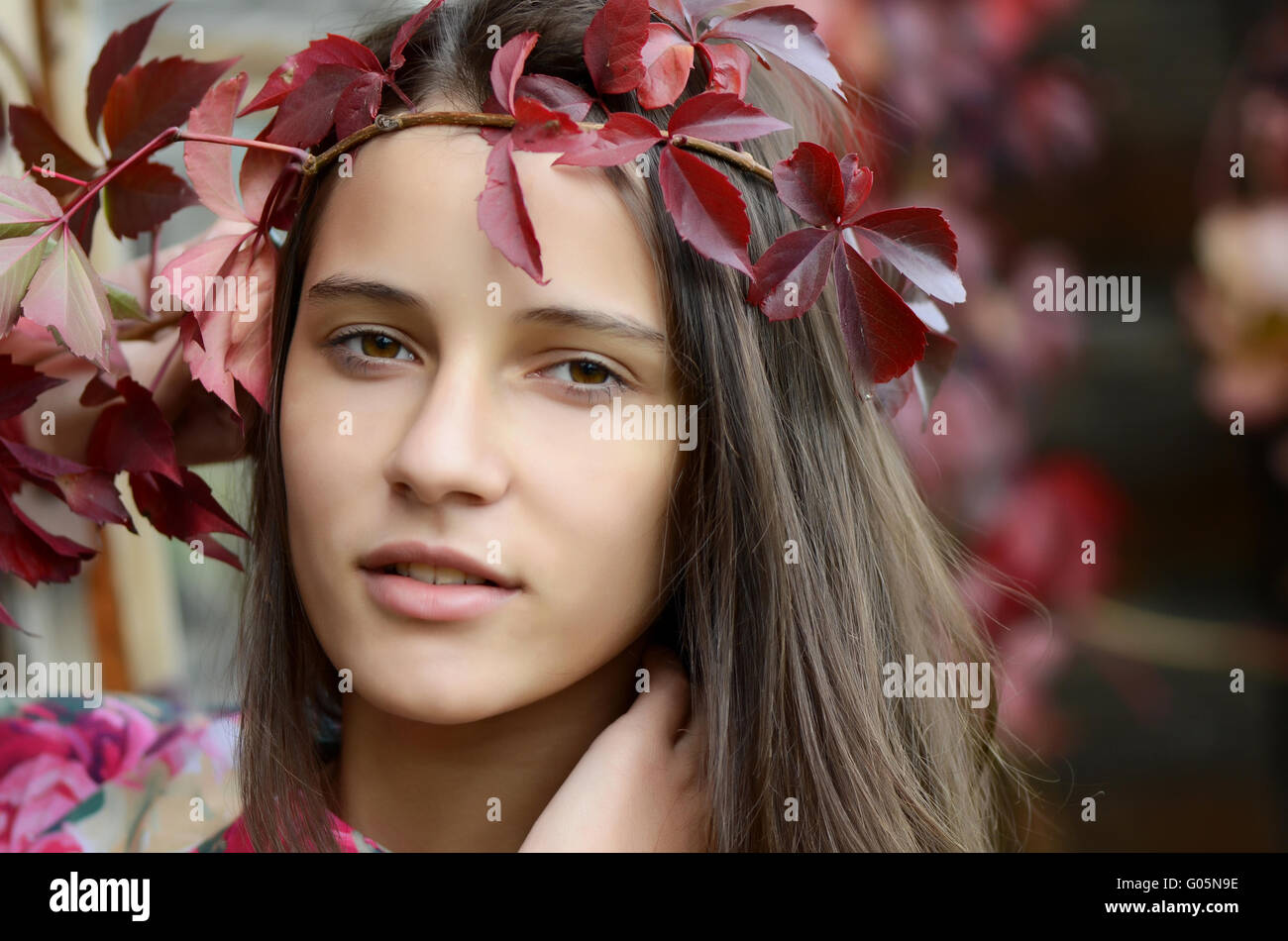 Portrait of the young girl with autumn foliage Stock Photo - Alamy