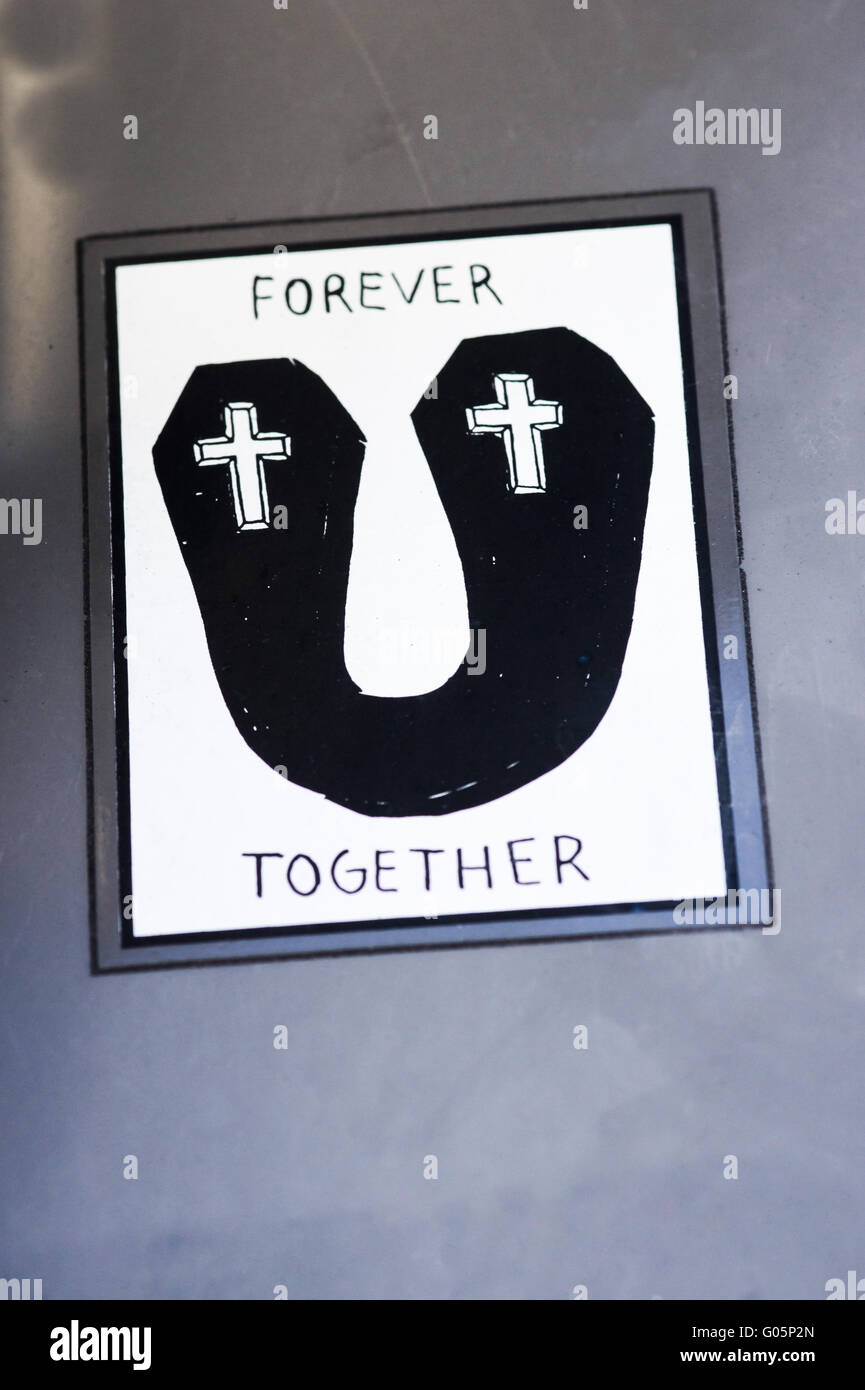 sticker showing two connected coffins with crosses Stock Photo