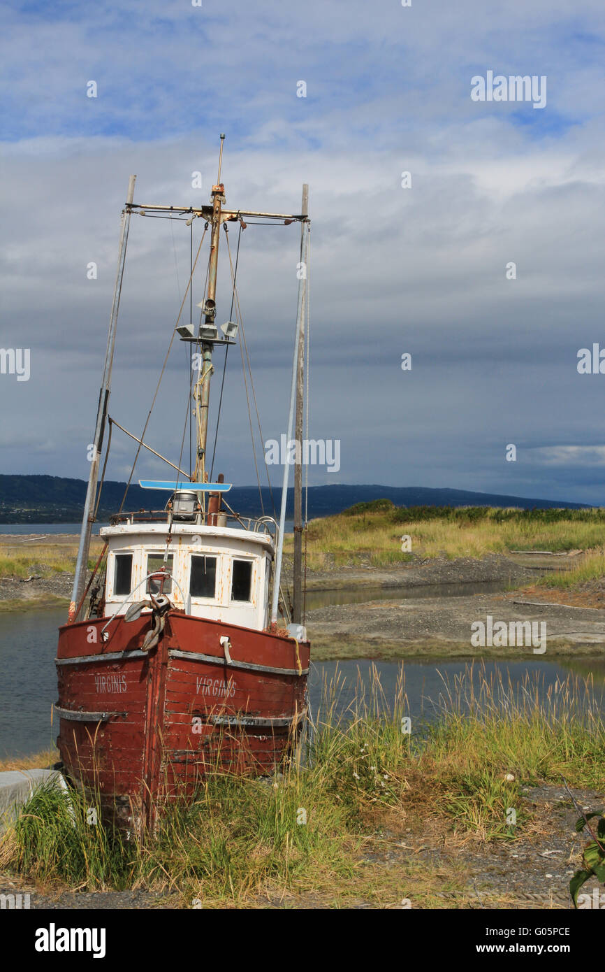 Stranded old fishing boat in Alaska Stock Photo