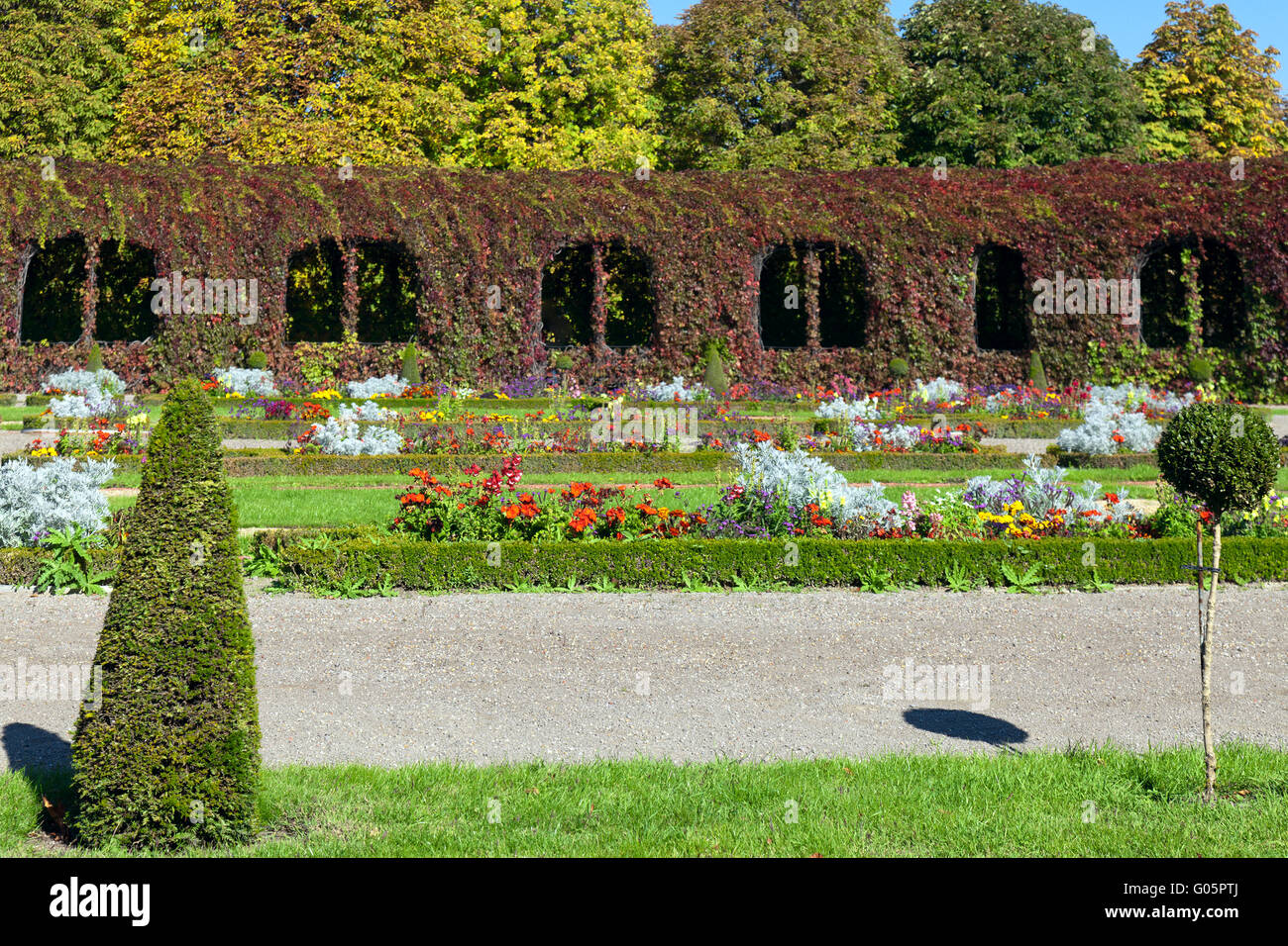 Green lawn in a colorful landscaped formal garden Stock Photo - Alamy