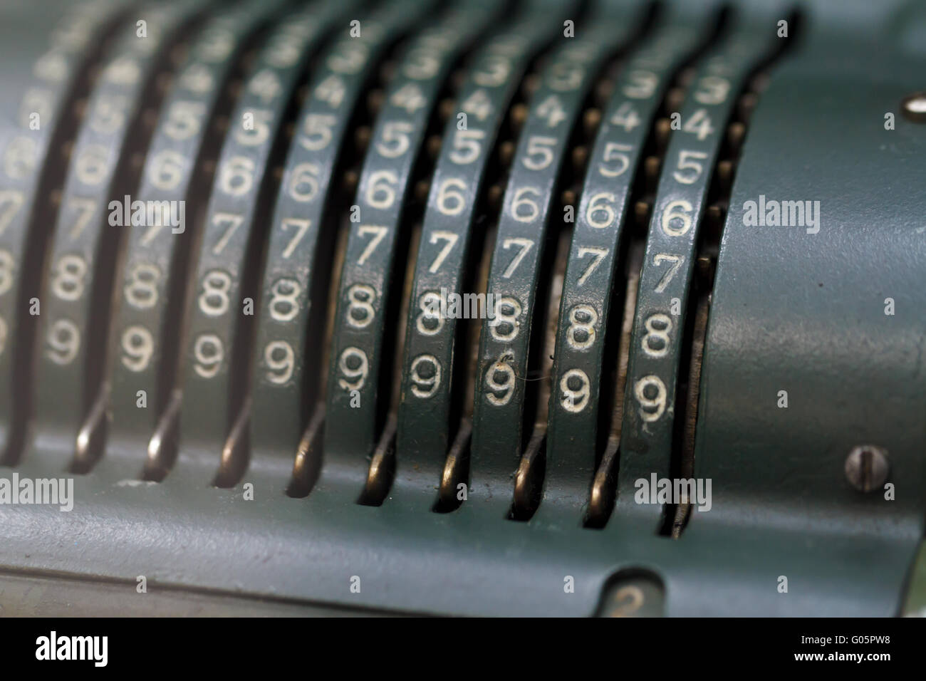 Close up detailed view of historical old calculator with small iron ...