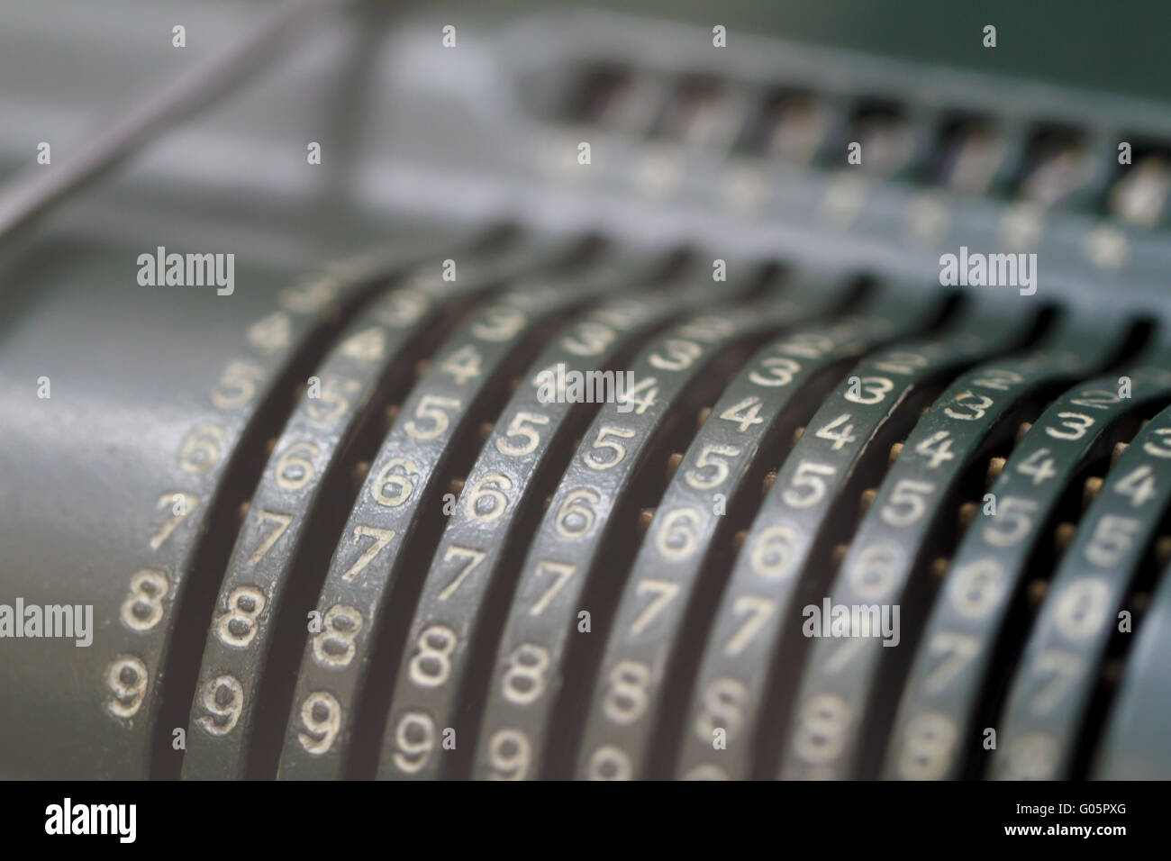 Close up detailed view of historical old calculator with small iron ...