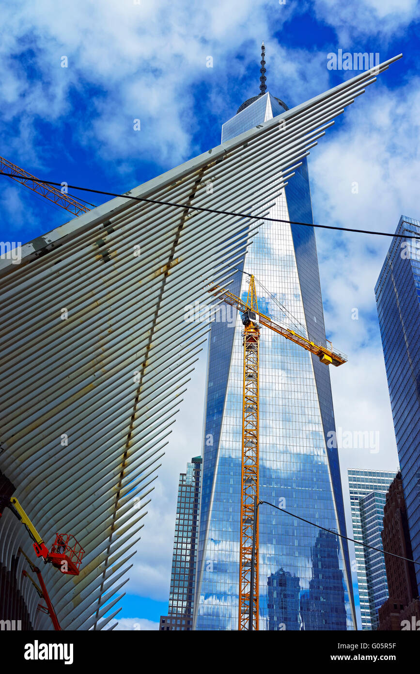 New York, USA - April 24, 2015: Detail of wing of WTC Transportation Hub and Skyscrapers and Freedom Tower in Financial District, Lower Manhattan, New York City, USA. It is designed by Santiago Calatrava Stock Photo