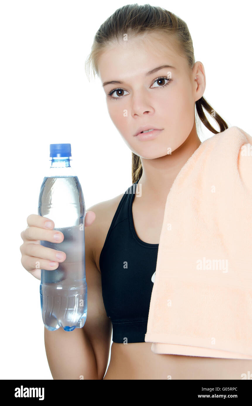 The sports girl with a towel and a water bottle Stock Photo - Alamy