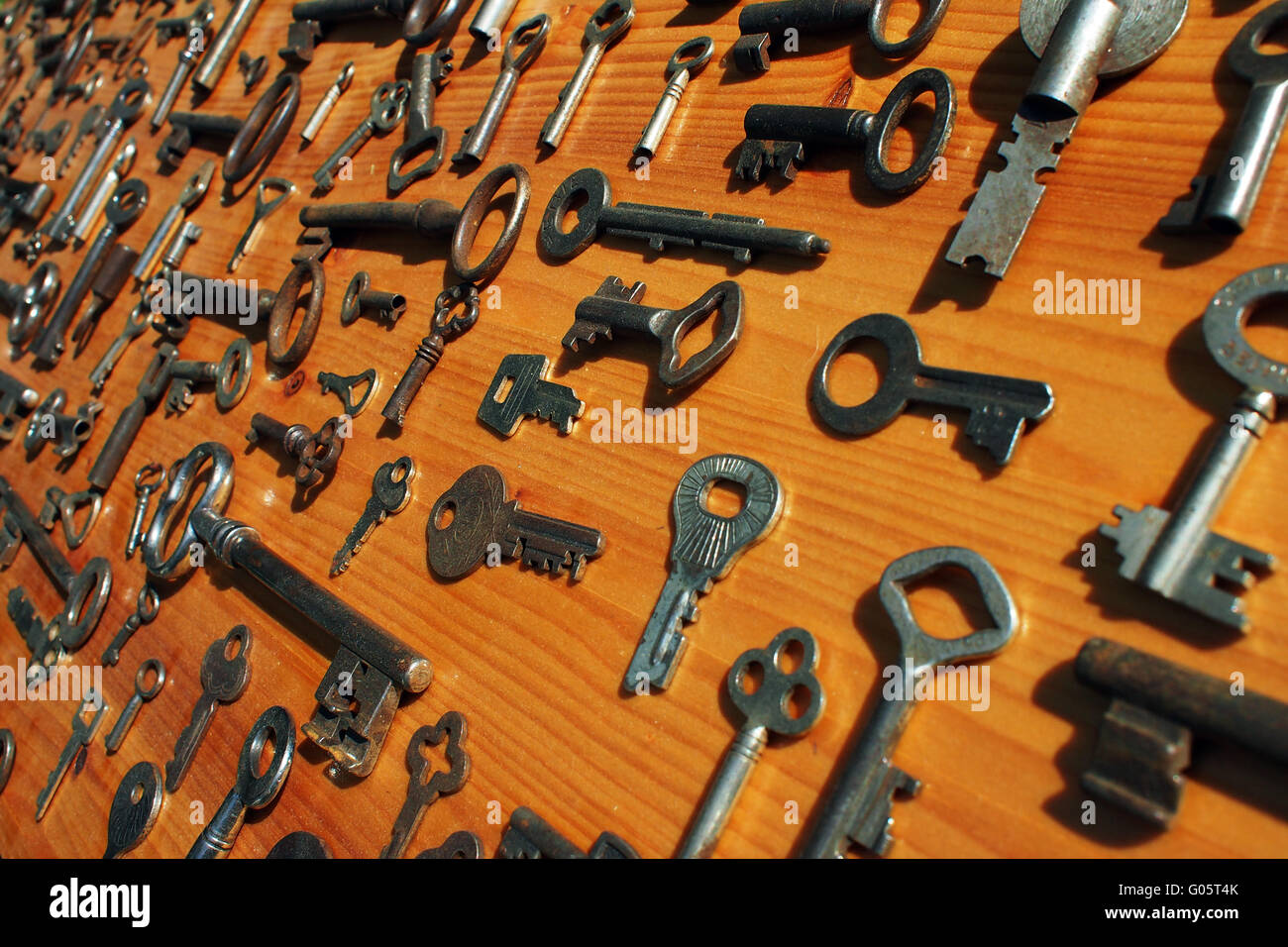 classic antik old keys on a board Stock Photo Alamy