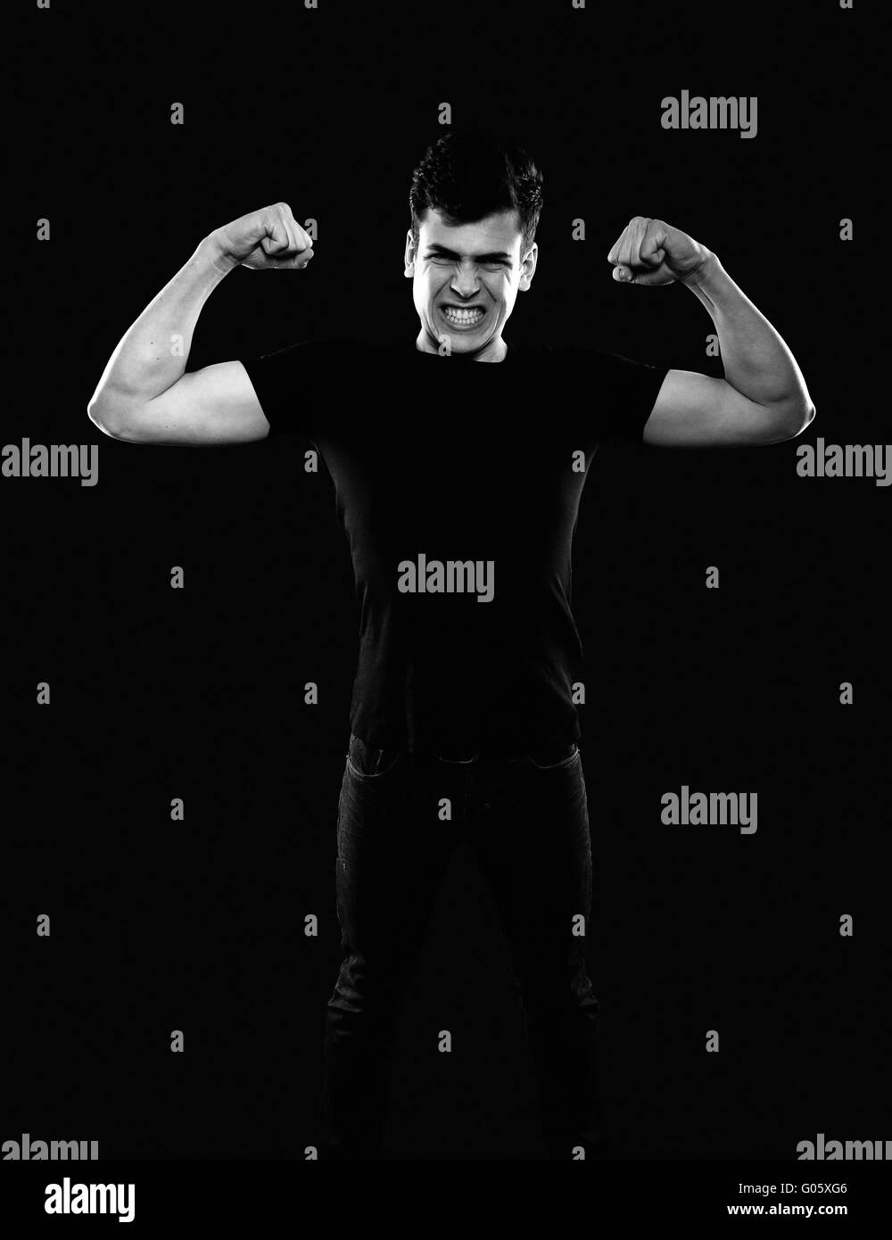 young man showing his muscles Stock Photo