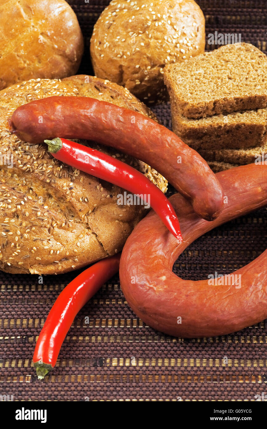 pepper sausage and bread as a food background Stock Photo