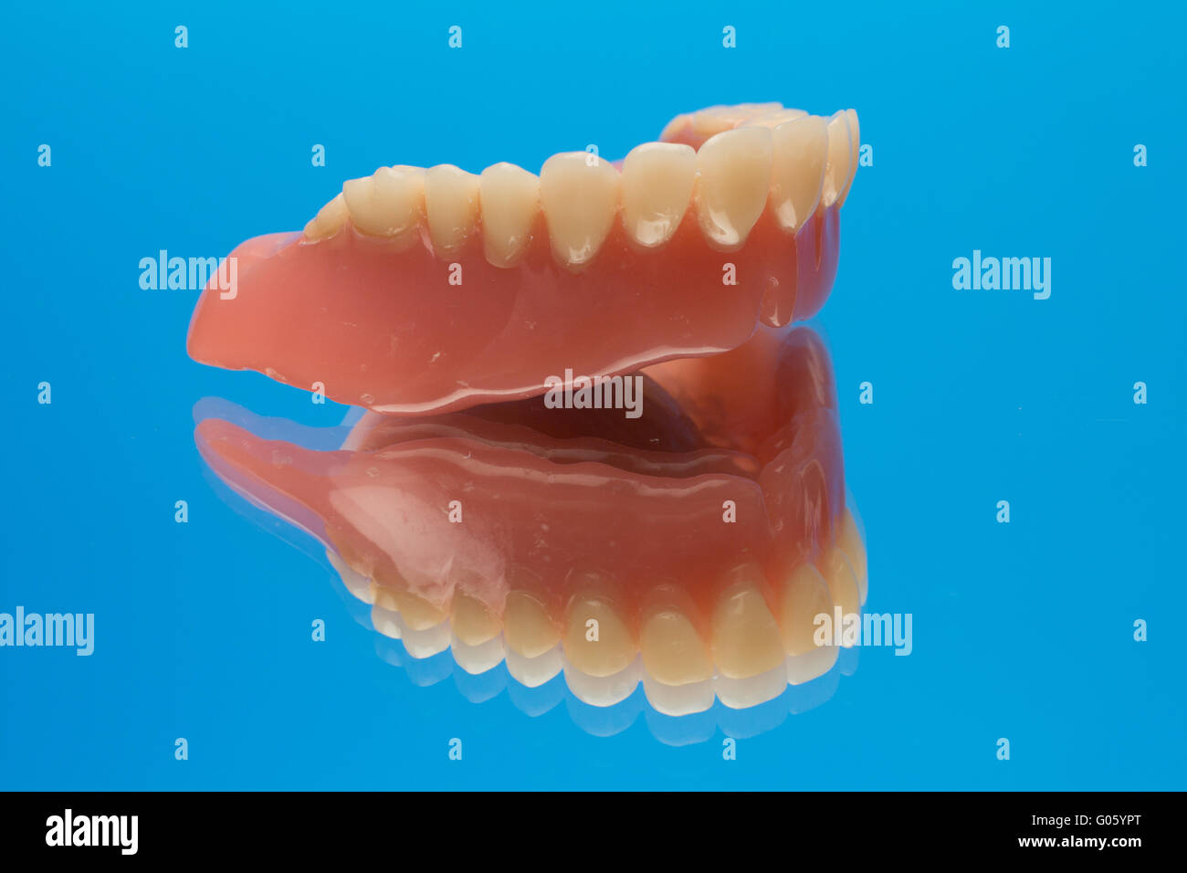 Denture prosthesis on mirror Stock Photo