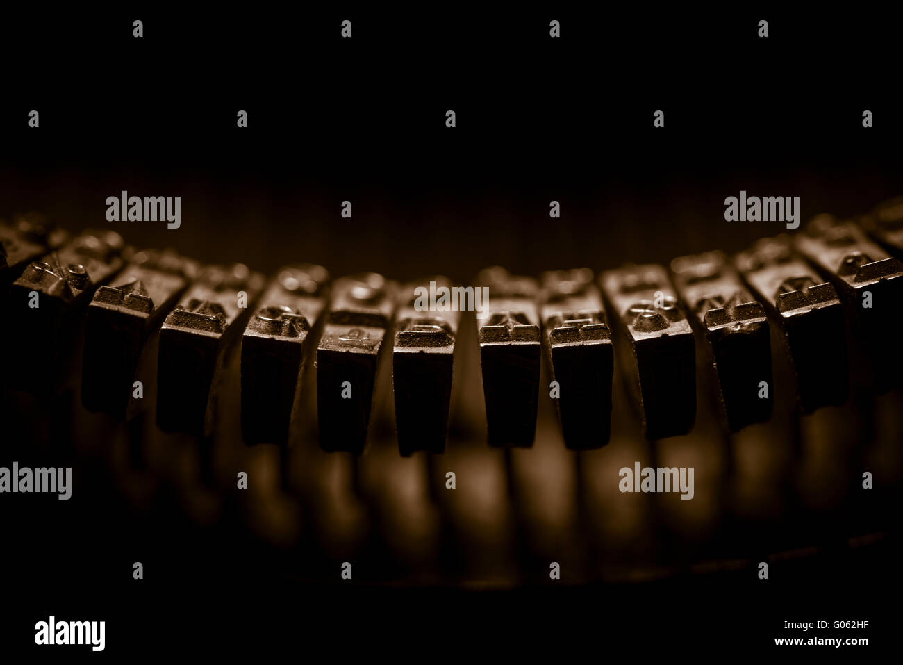 Letters on typewriter in extreme close up. Concept of writing, old fashioned correspondence and journalism. Stock Photo