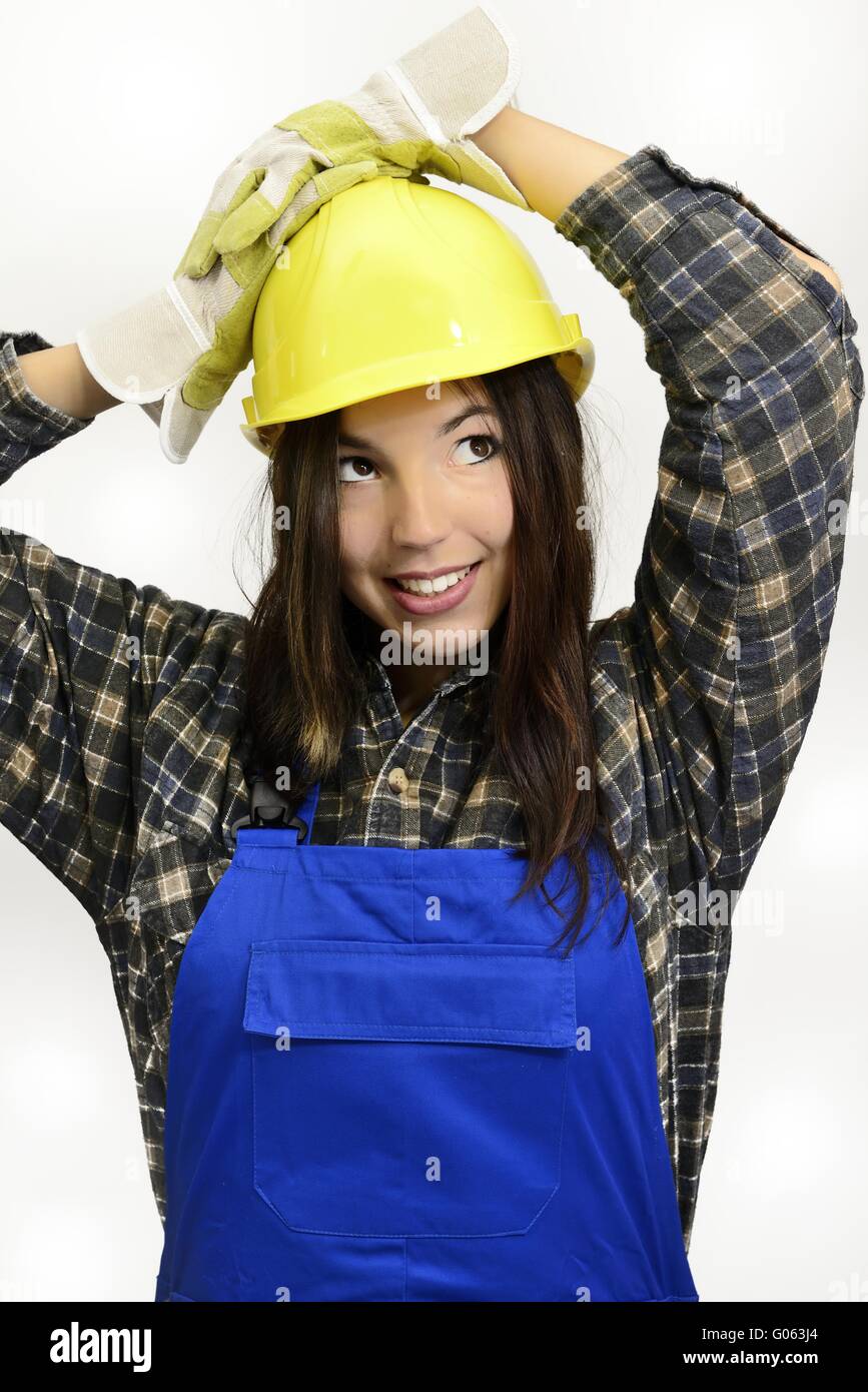 brunette young woman with work clothes and safety Stock Photo