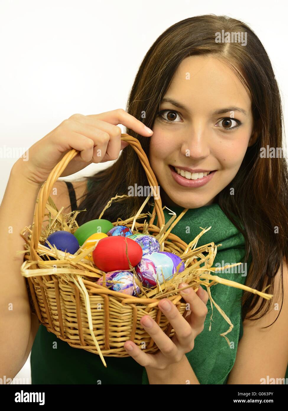 young brunette woman smiling with a basket full of Stock Photo - Alamy