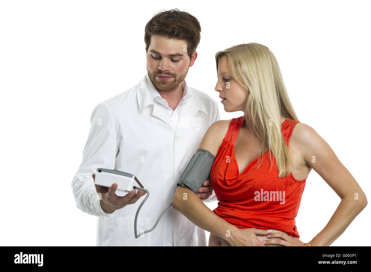 Doctor measures the blood pressure of a pregnant w Stock Photo