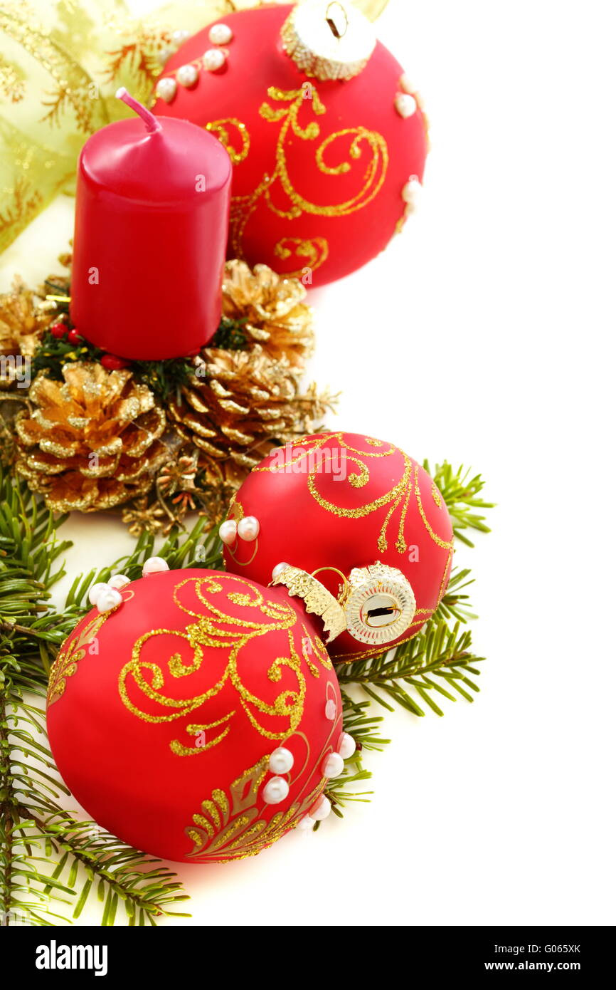 Christmas composition with red balls and candles. Stock Photo