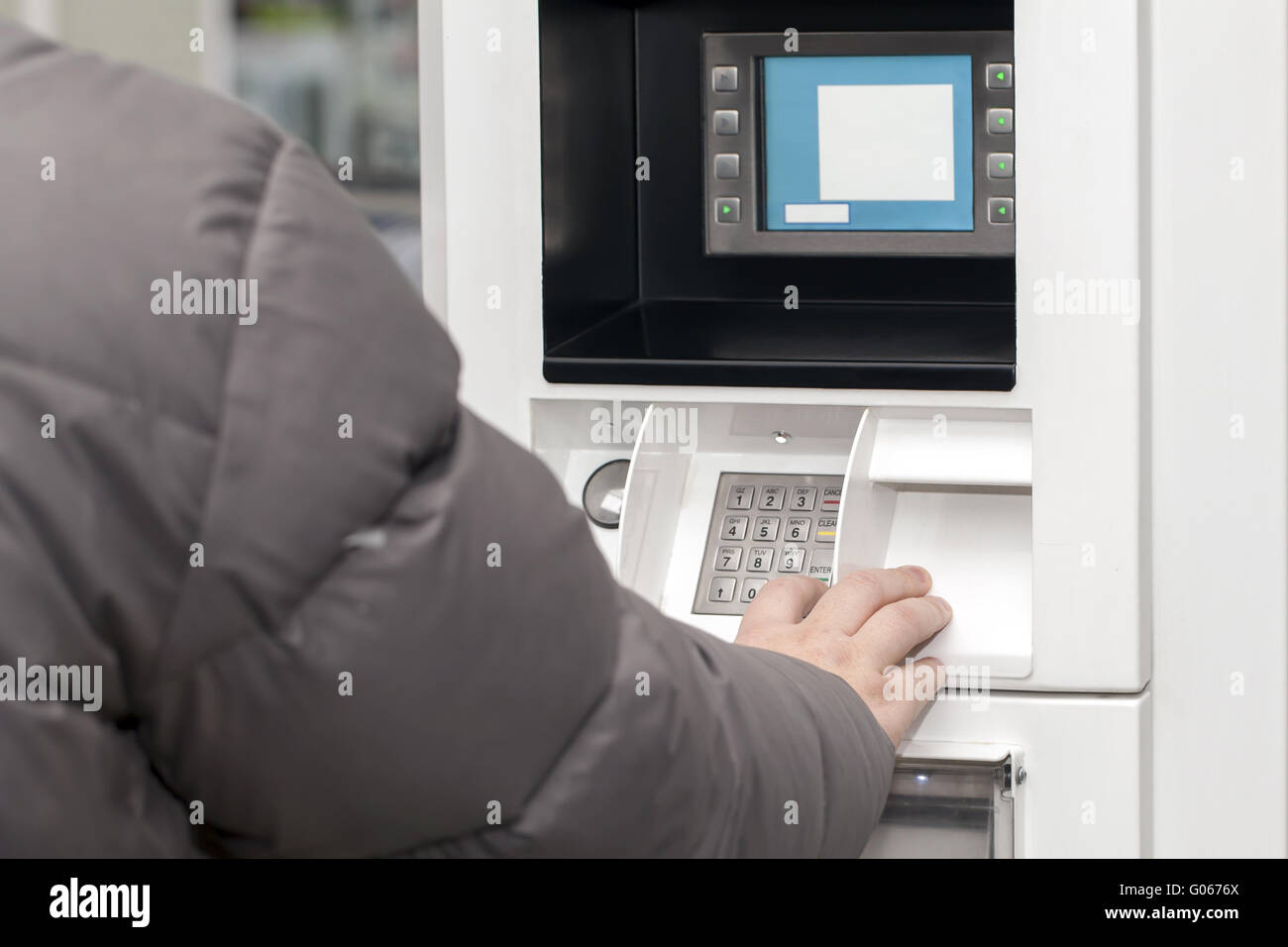 Man's hand near the cash machine in Gas Station Stock Photo Alamy