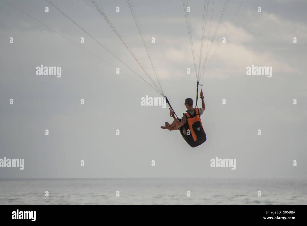 Man doing paragliding Stock Photo - Alamy