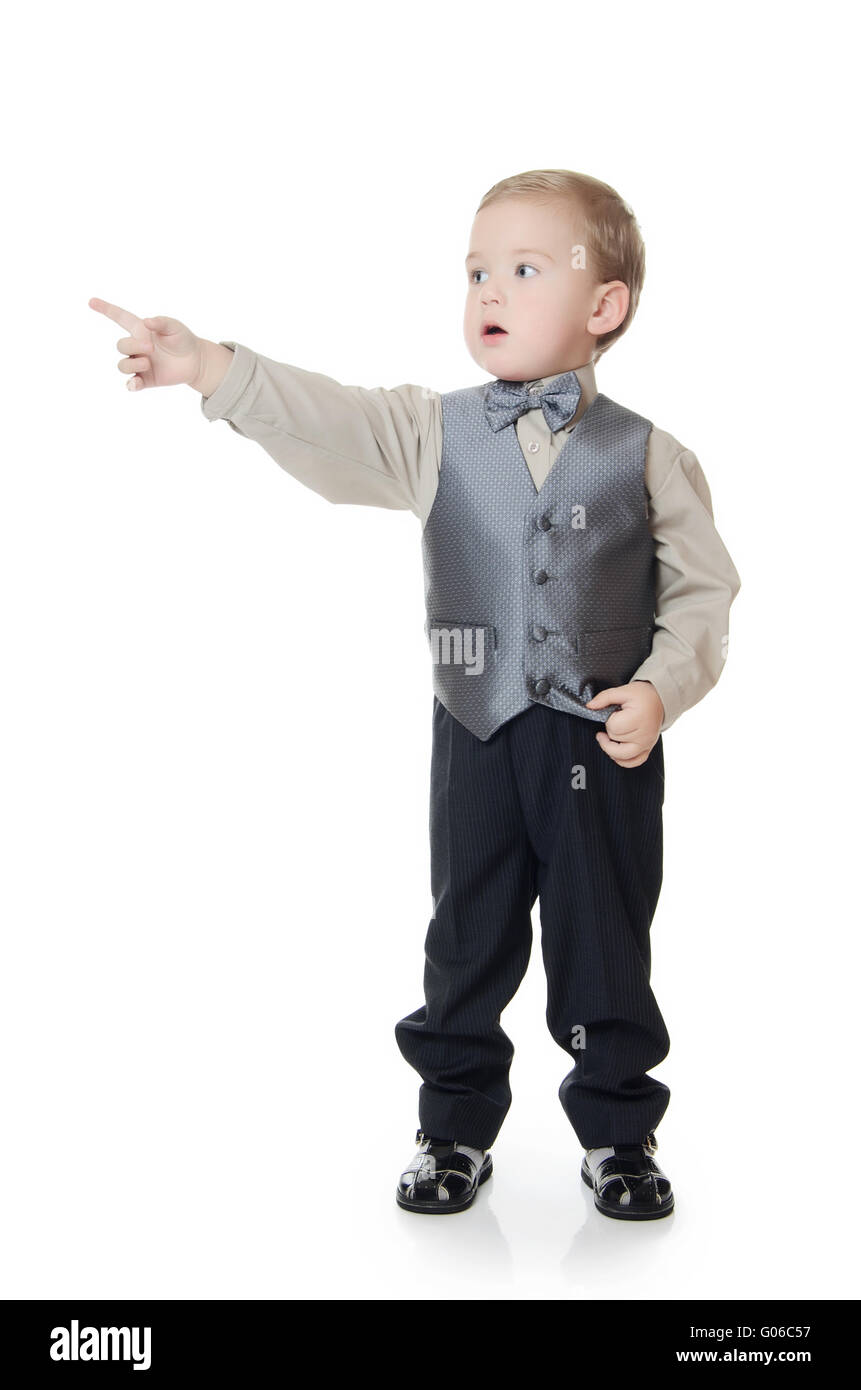 The little boy in a business suit shows a finger Stock Photo