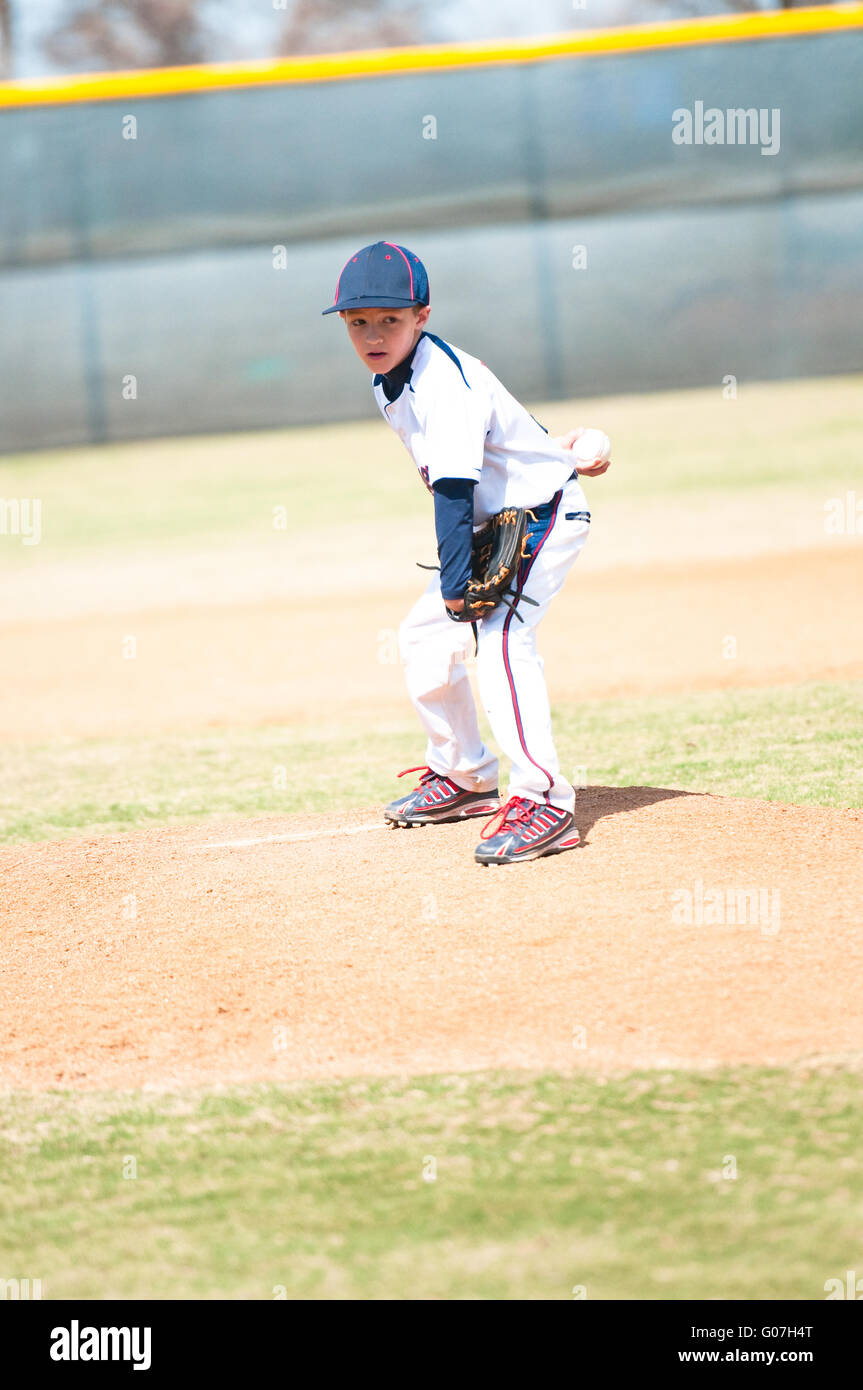 Youth baseball pitcher looking. Stock Photo