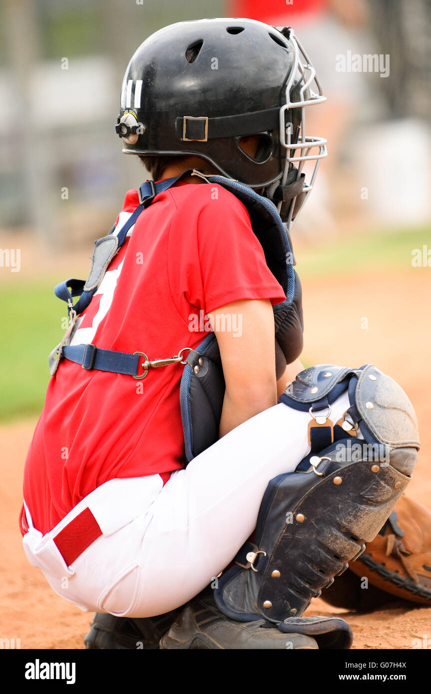 Catcher in red jersey Stock Photo