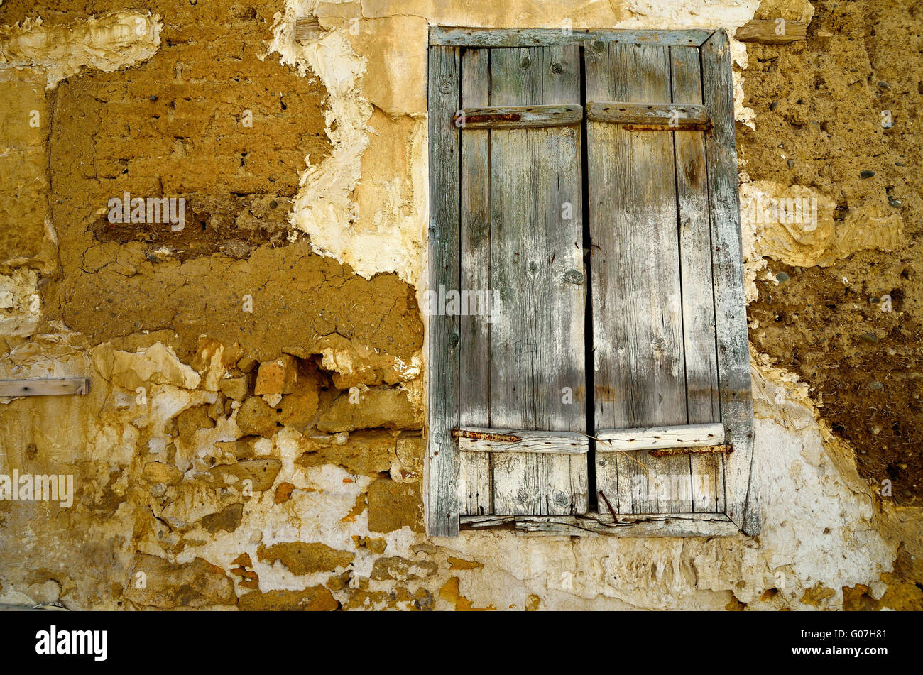 Fragment wall of old abandoned house with closed window Stock Photo - Alamy